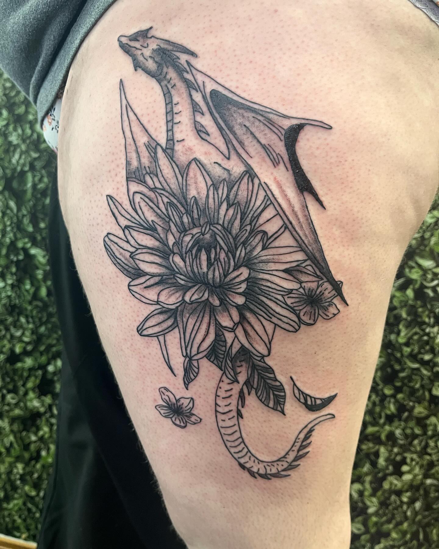 Dragon and flower realism tattoo on the thigh by Michelle