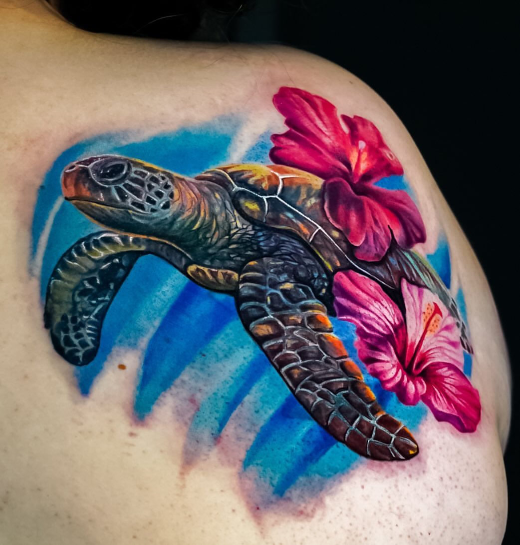 Sea turtle and hibiscus realism tattoo on the shoulder by David Gordon