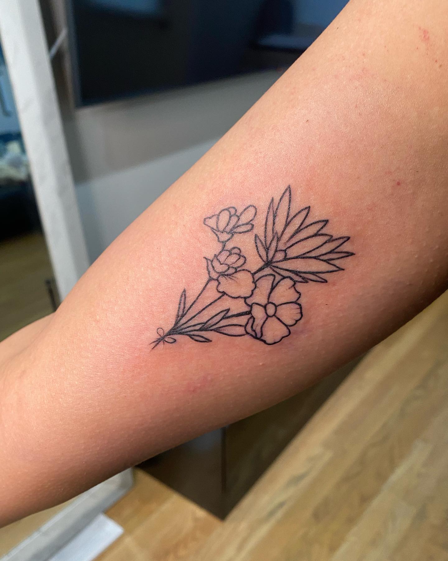 Flowers fine line tattoo on the forearm by Ray Trombetta, Wallingford, Connecticut