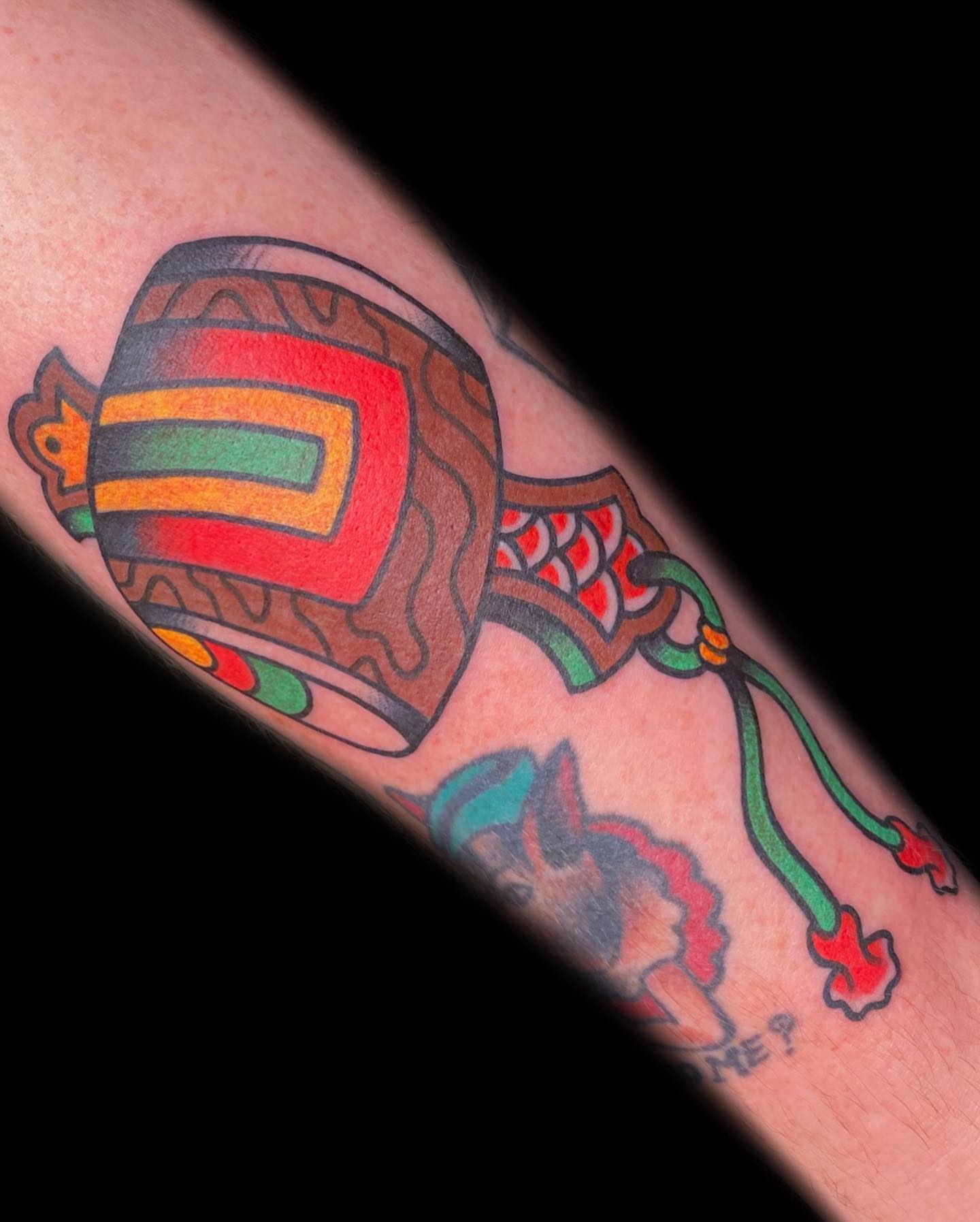 Drum and dragon American traditional tattoo on the forearm by The Calamari Kid