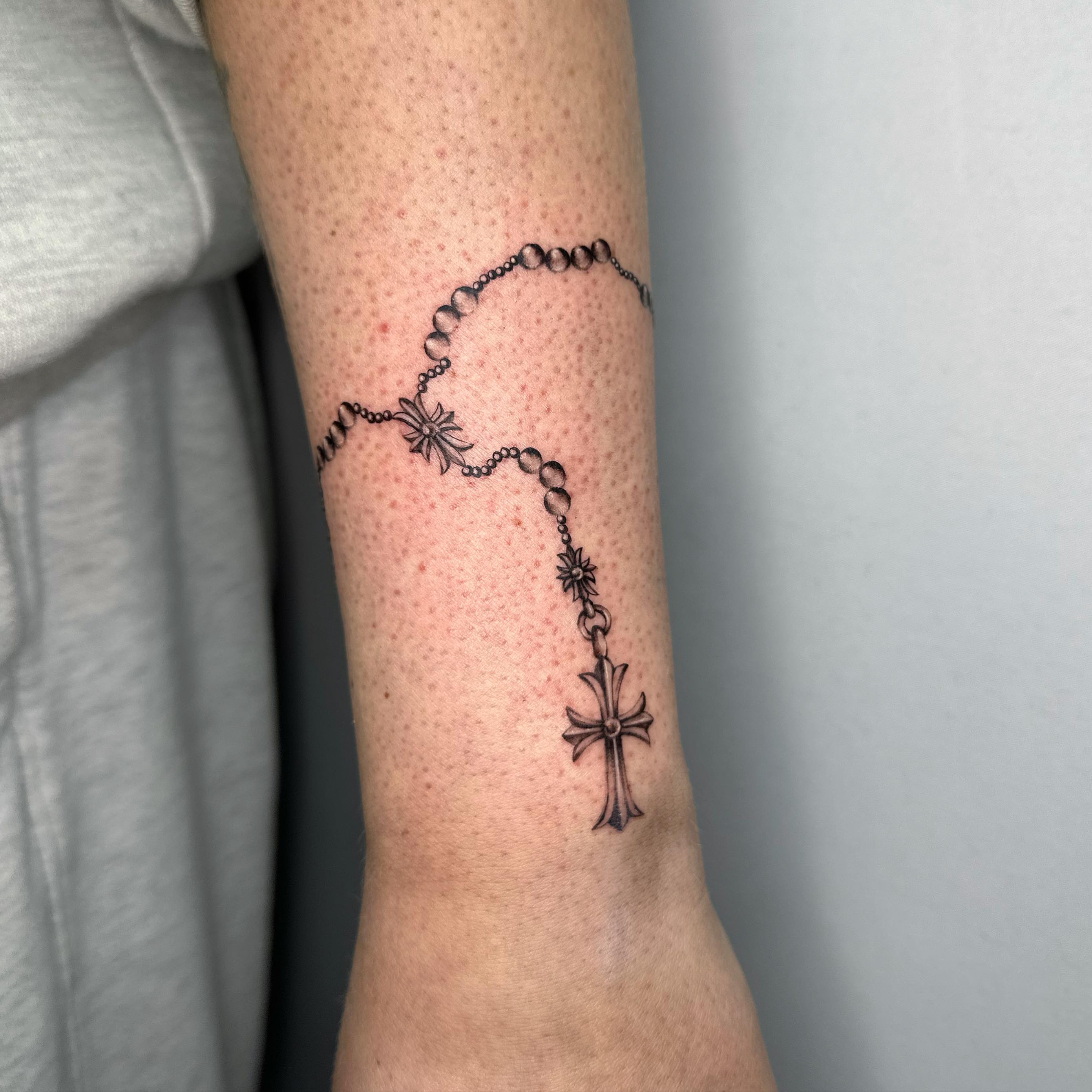 Rosary black and grey tattoo on the forearm by ๐๐๐๐ ๐๐๐๐
