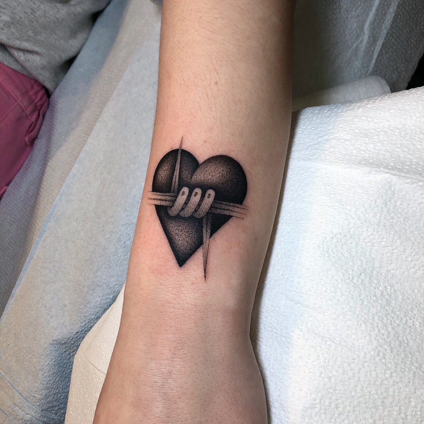 Heart with rope dotwork tattoo on the forearm by Mickey