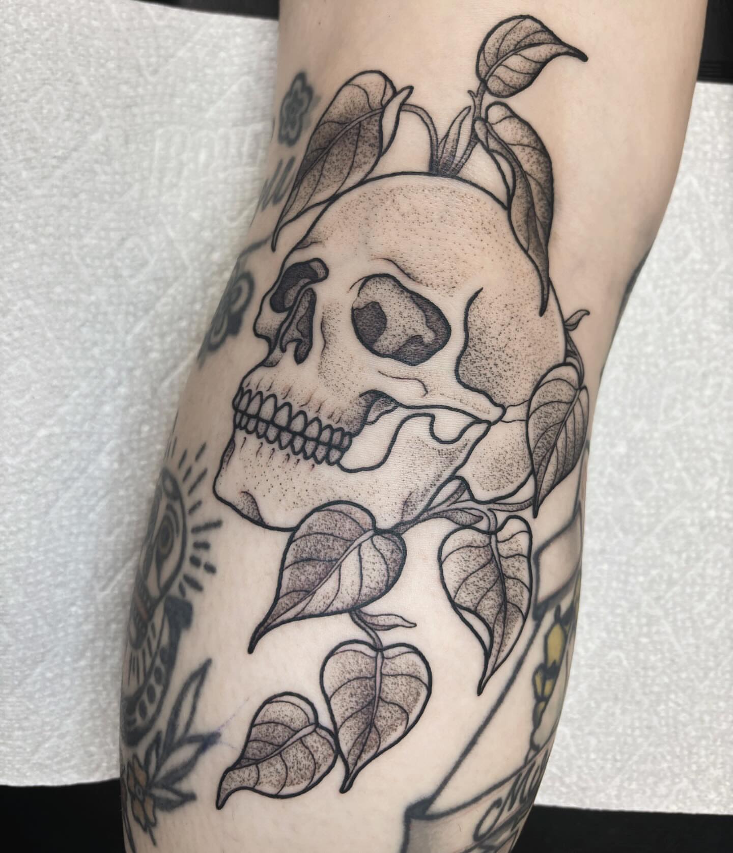 Skull and leaves dotwork tattoo on the forearm by 𝐀𝐘𝐀𝐍𝐀𝐇