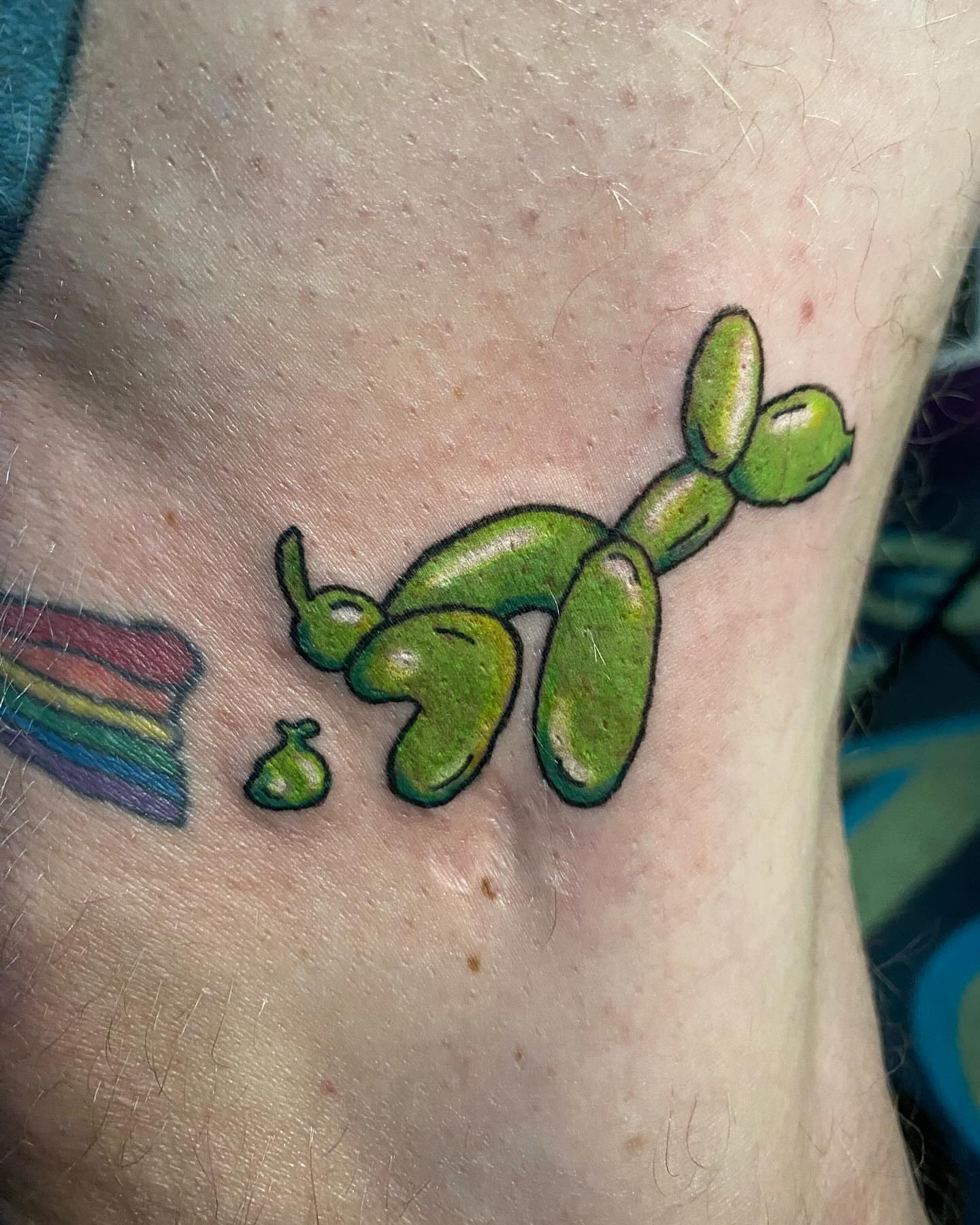 Balloon animal new school tattoo on the forearm by Tesla Kohl