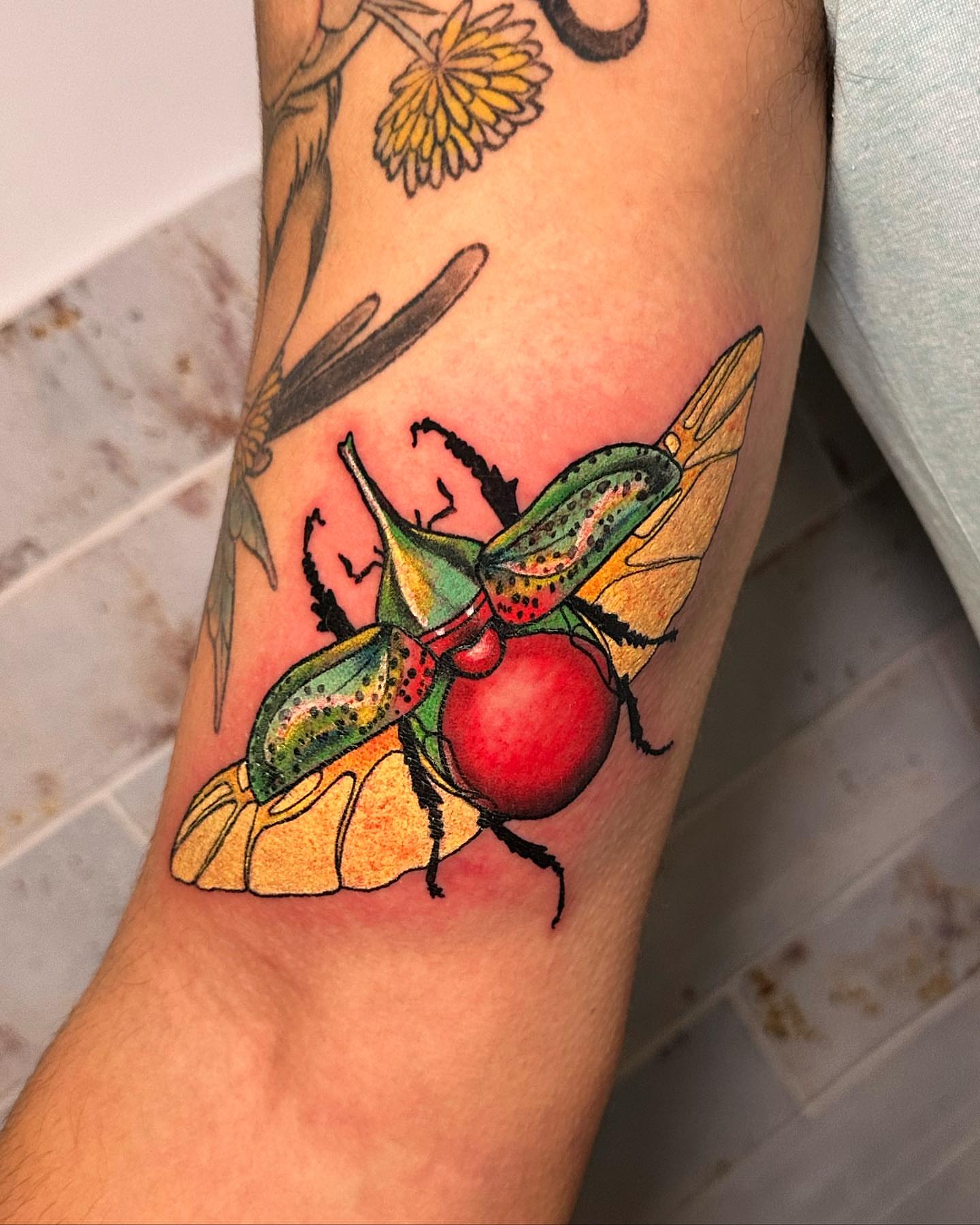 Beetle American traditional tattoo on the forearm by Marta La Jirafa