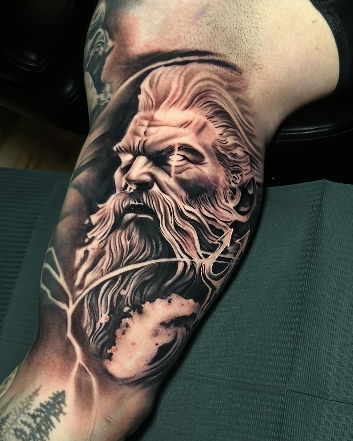 Bearded man realism tattoo on the forearm by Miguel Saucedo