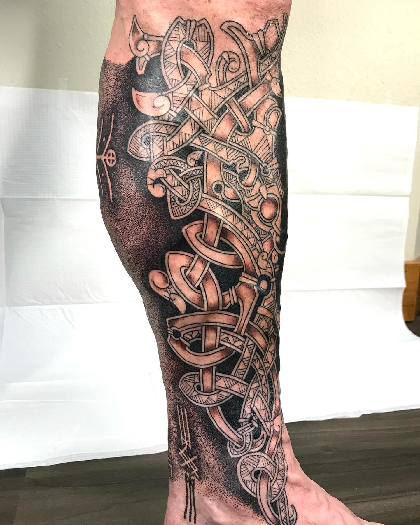 Viking knotwork geometric tattoo on the calf by Ian Spencer