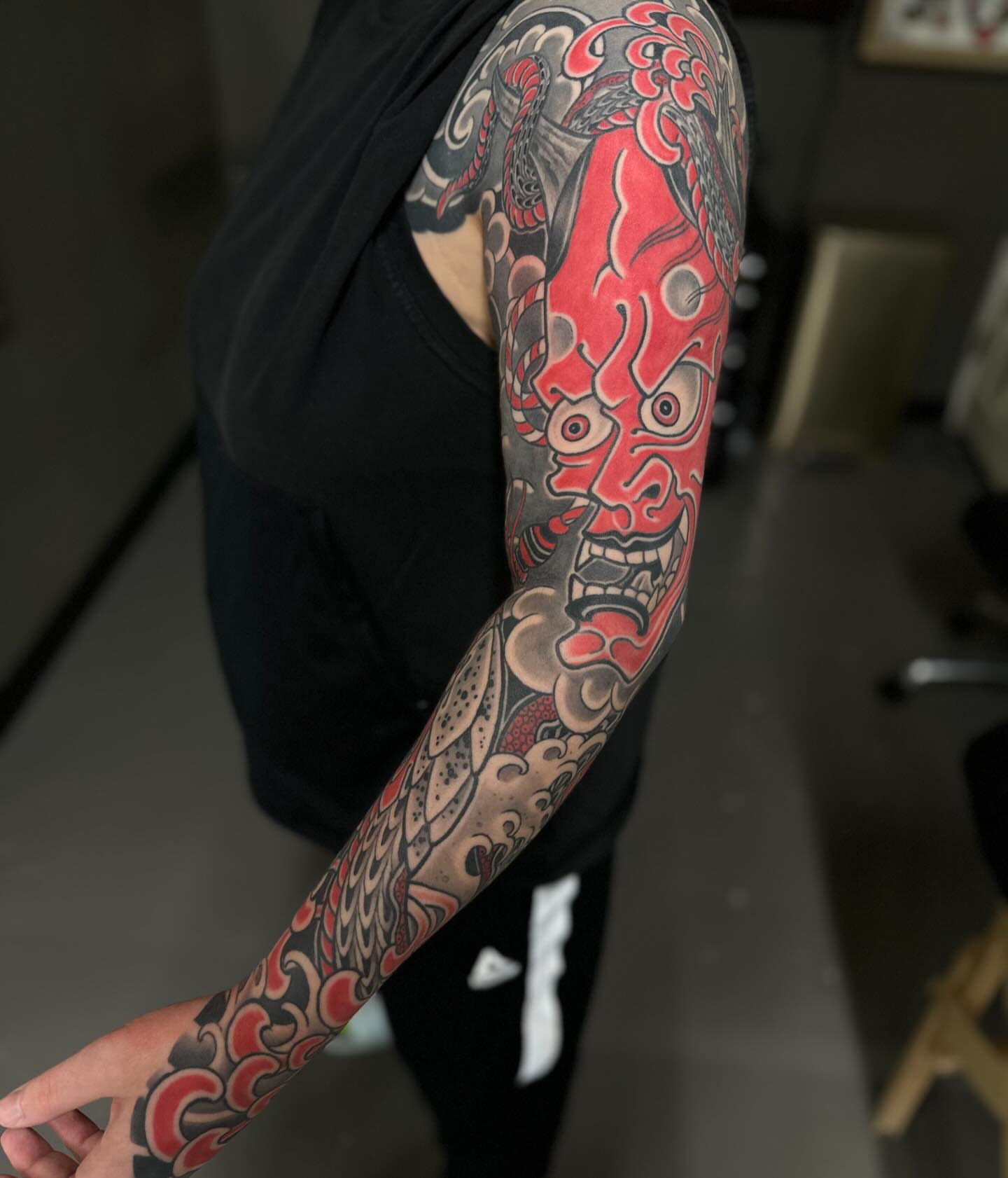 Demon mask japanese irezumi tattoo on the upper arm by Chris Rogers