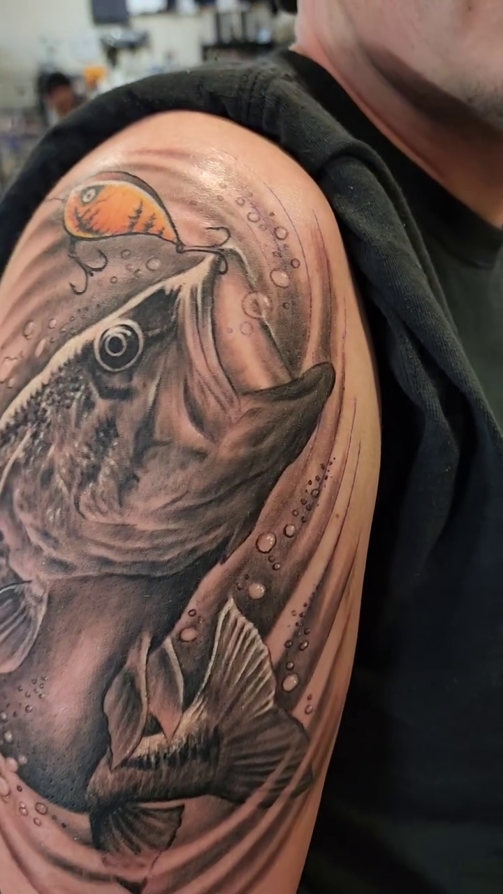 Large mouth bass and lure realism tattoo by Martin Colonna
