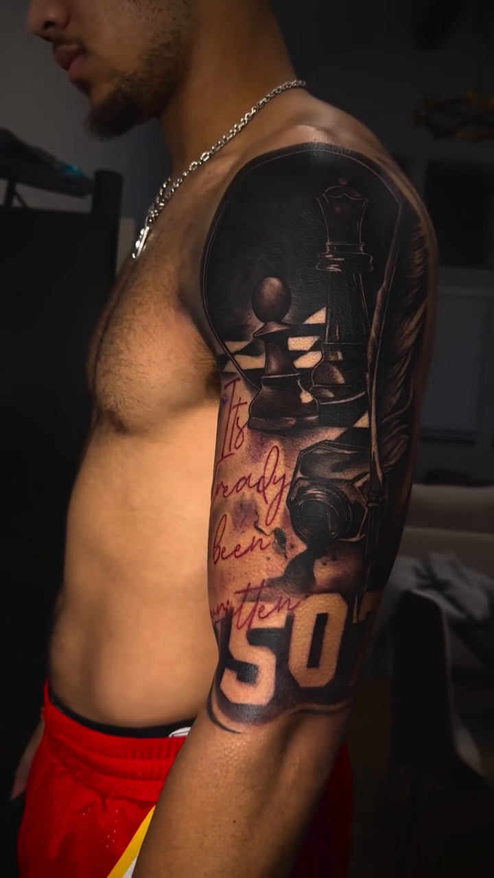 Skull and number 50 realism tattoo by Anwon Johnson
