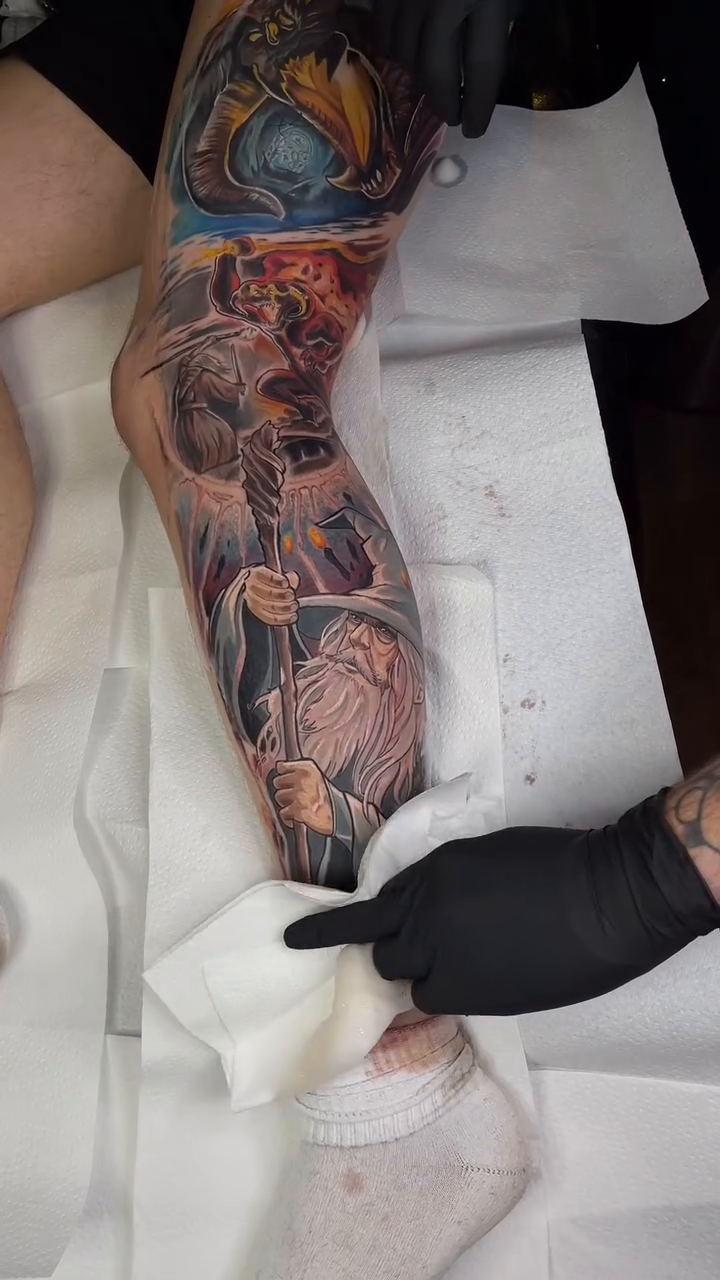 Dragon and wizard realism tattoo by Maryssa Anne