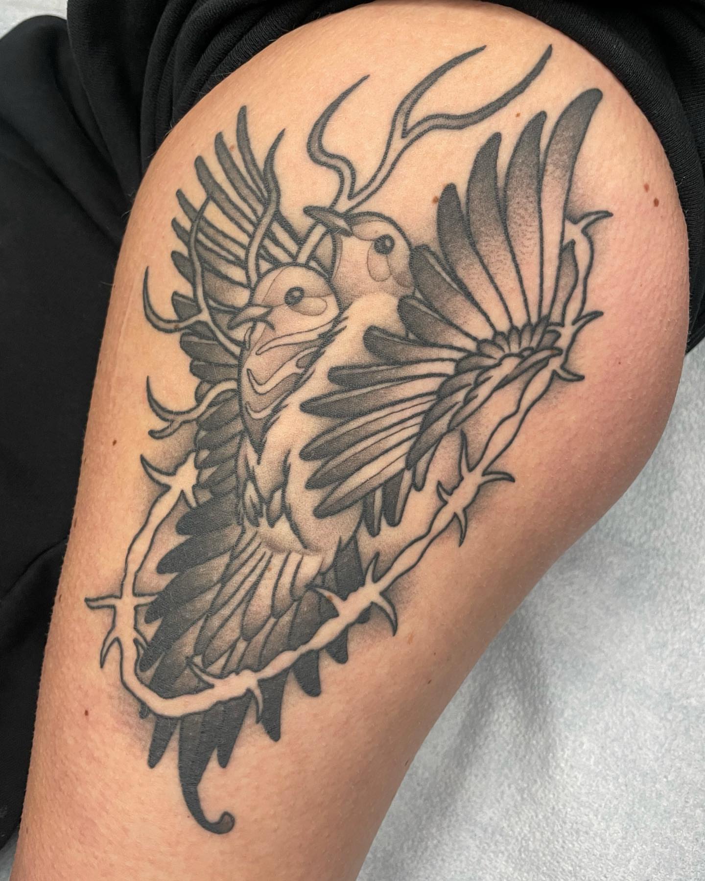 Birds black and grey tattoo on the thigh by Amy Jean, Minneapolis, Minnesota