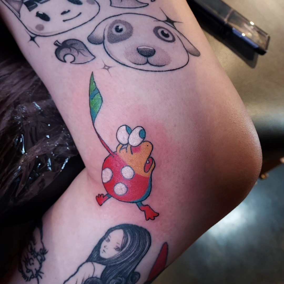 Frog with polka dots dotwork tattoo on the forearm by Spike Cameron