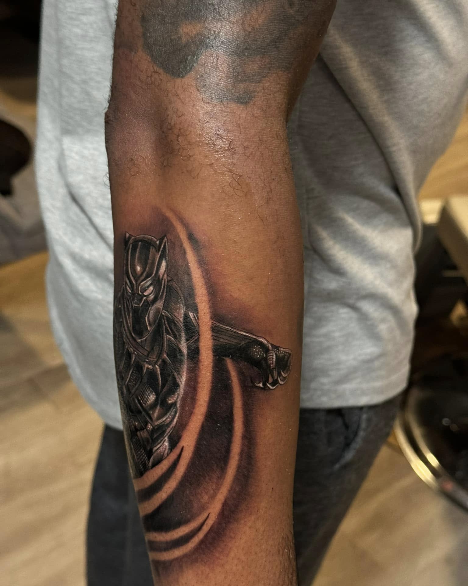 Black panther realism tattoo on the forearm by Chris_Tatt2_D’Ascenzo