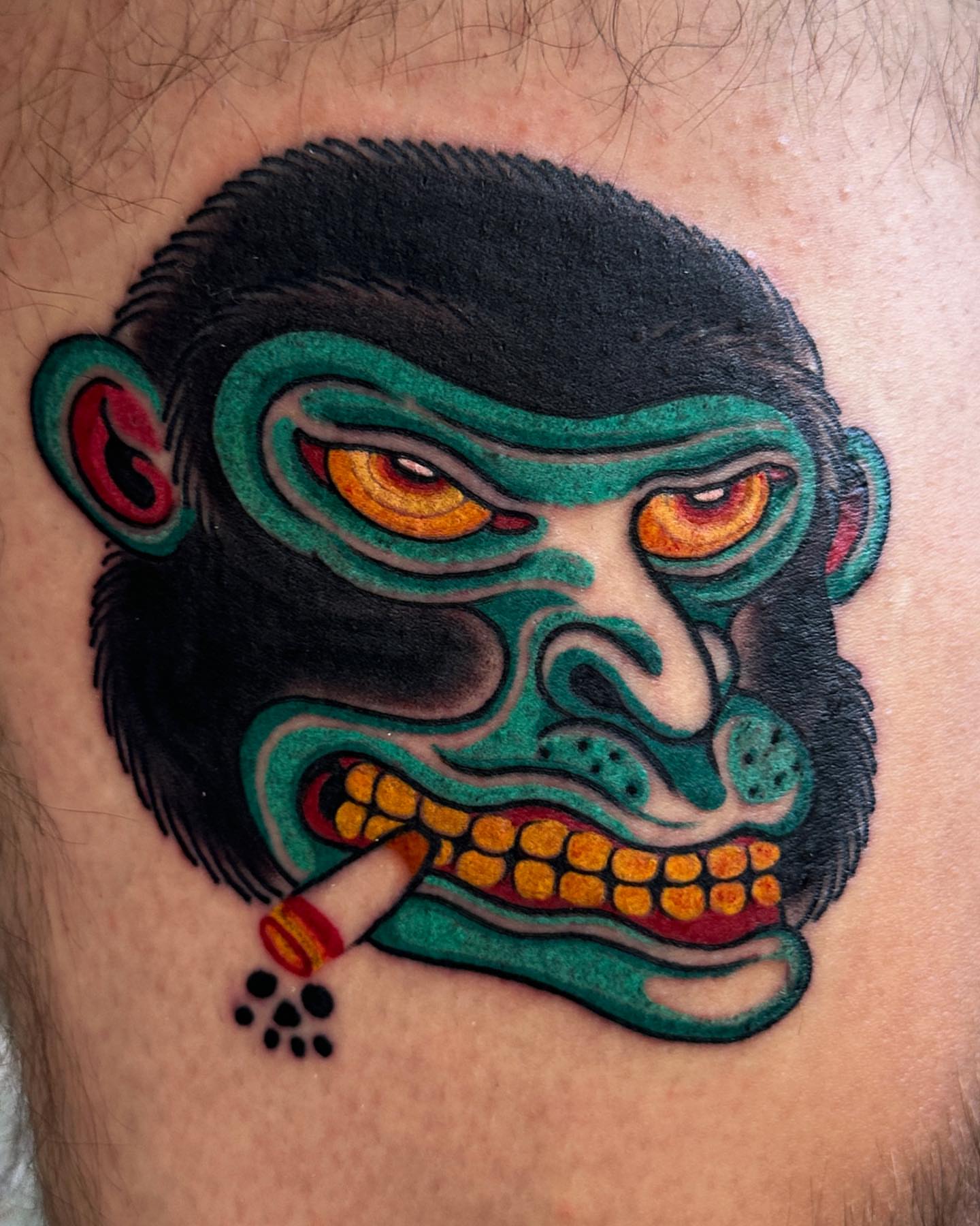Gorilla head American traditional tattoo on the thigh by Mario Arcila