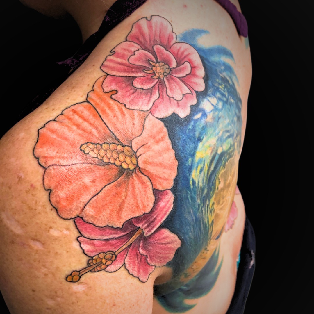 Hibiscus flowers realism tattoo on the shoulder by Jordan Rookus