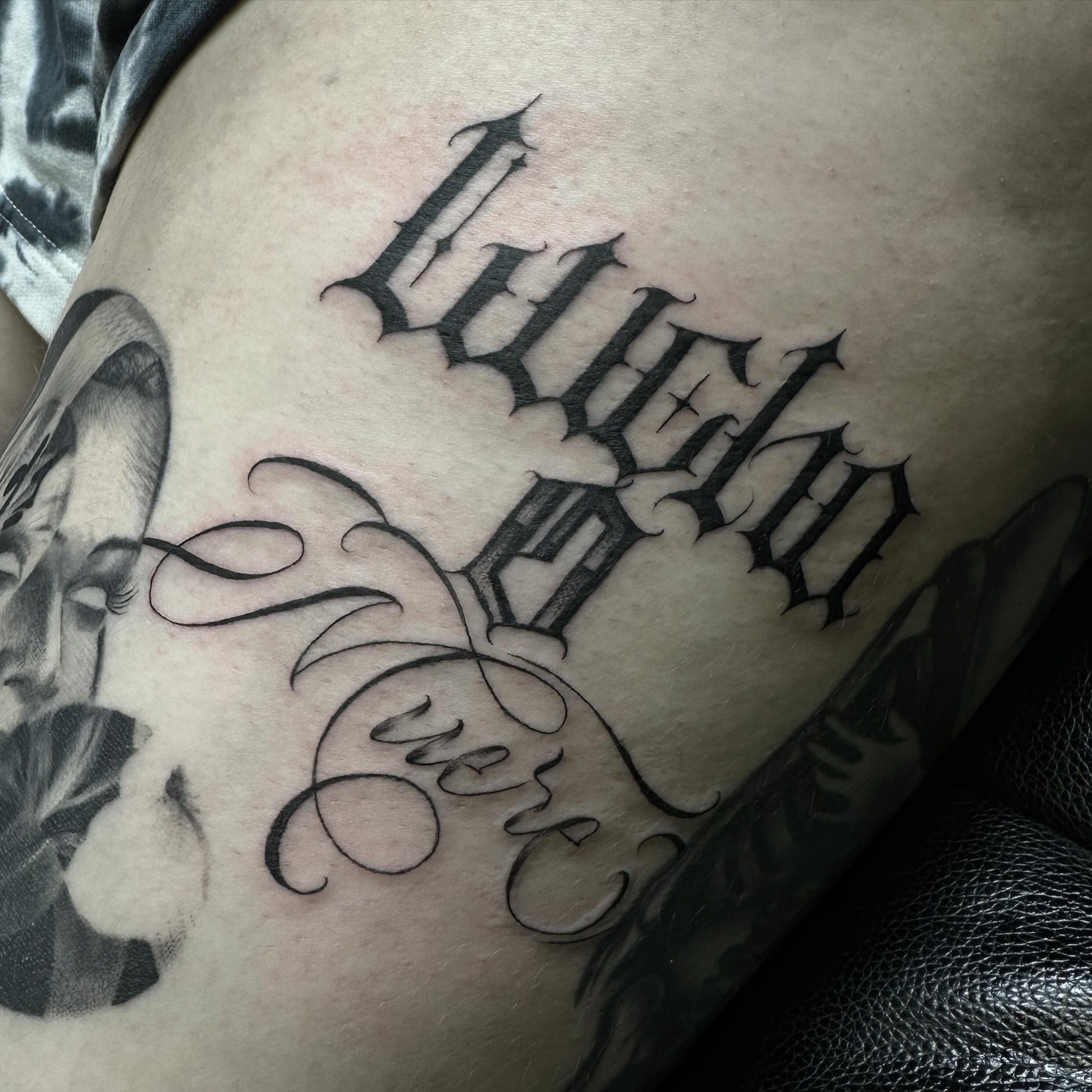 Gothic script lettering script tattoo on the thigh by Tattoosxjoseph