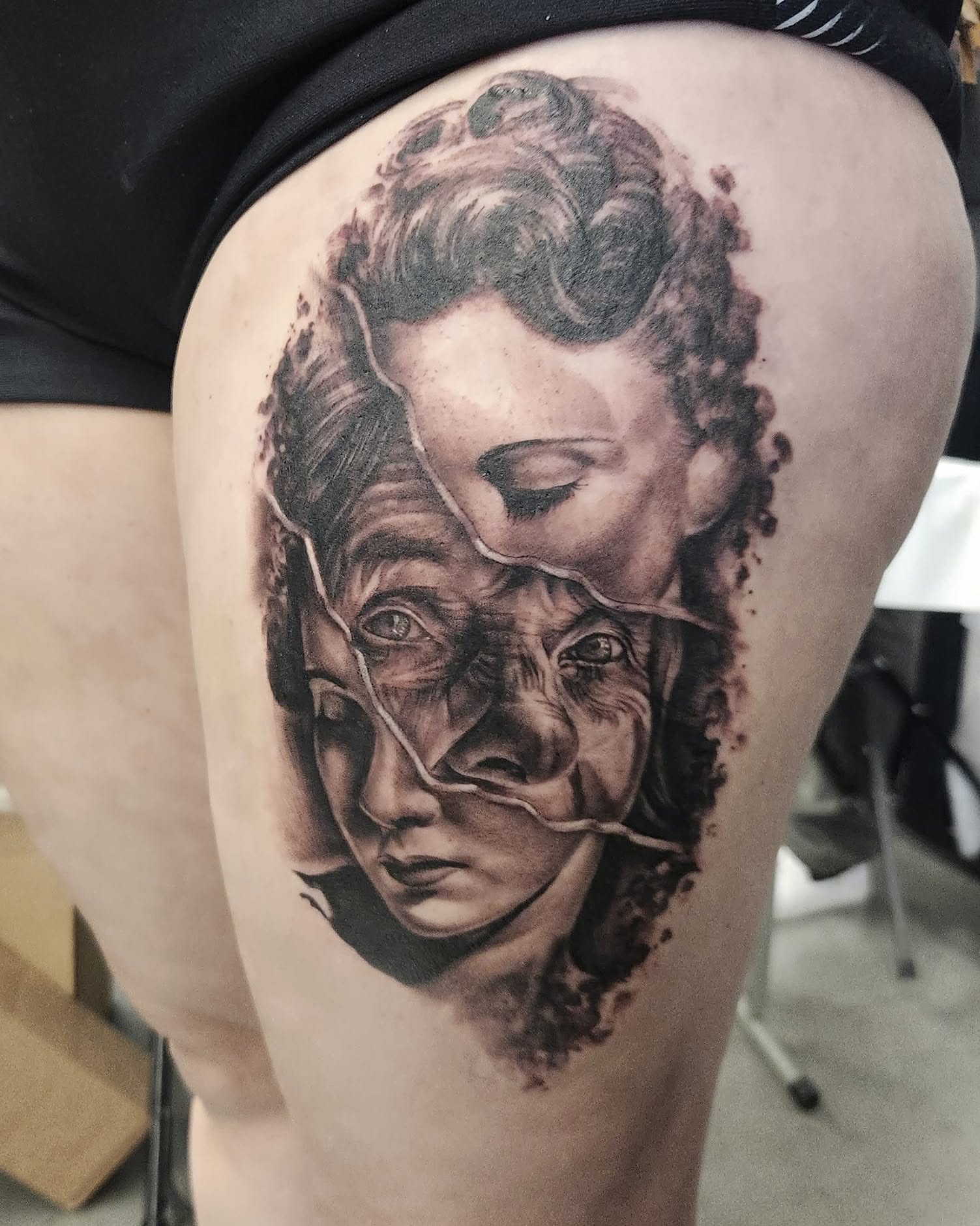 Woman's face realism tattoo on the thigh by Elidia Veliz