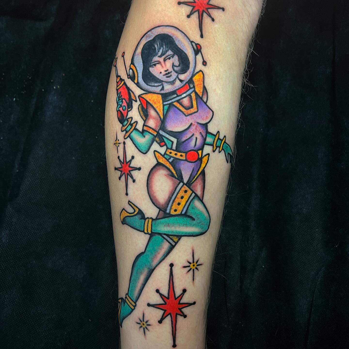 Astronaut pin-up girl American traditional tattoo on the forearm by Matt E.