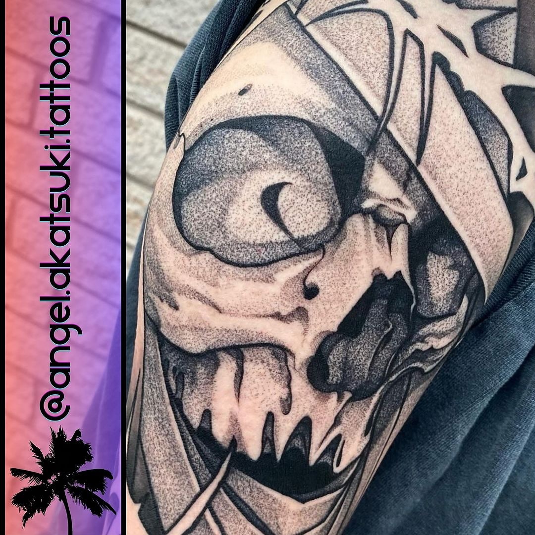 Skull dotwork tattoo on the shoulder by Angel Rodriguez
