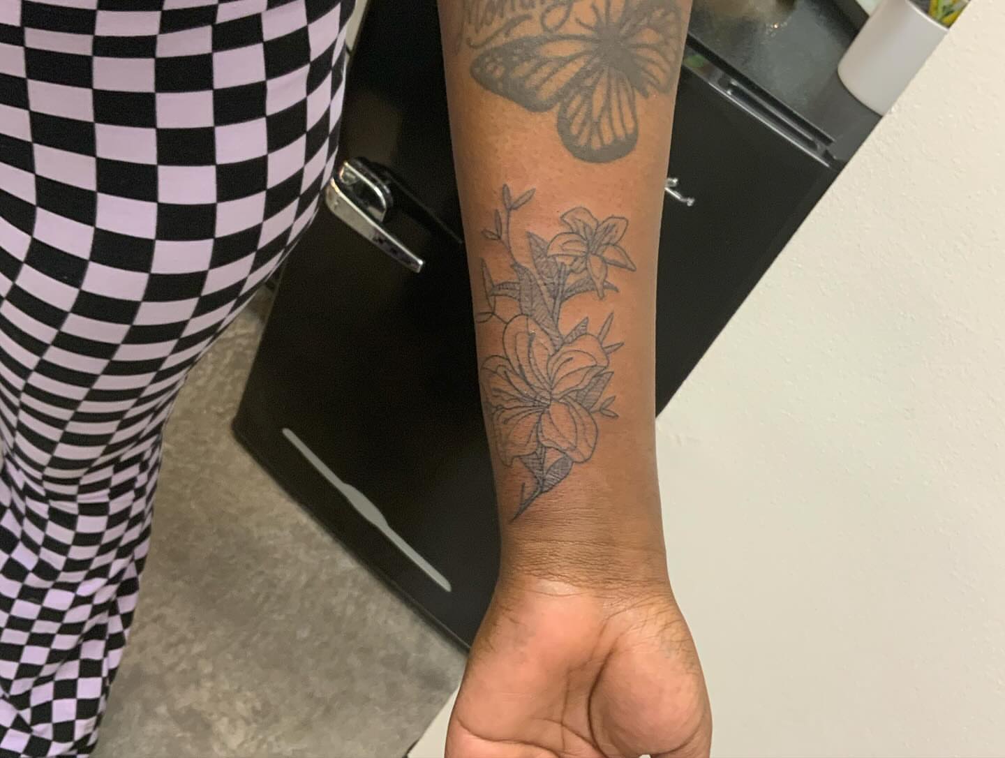Butterfly and flowers black and grey tattoo on the forearm by ⁘ heléna tupou-lisle ⁘