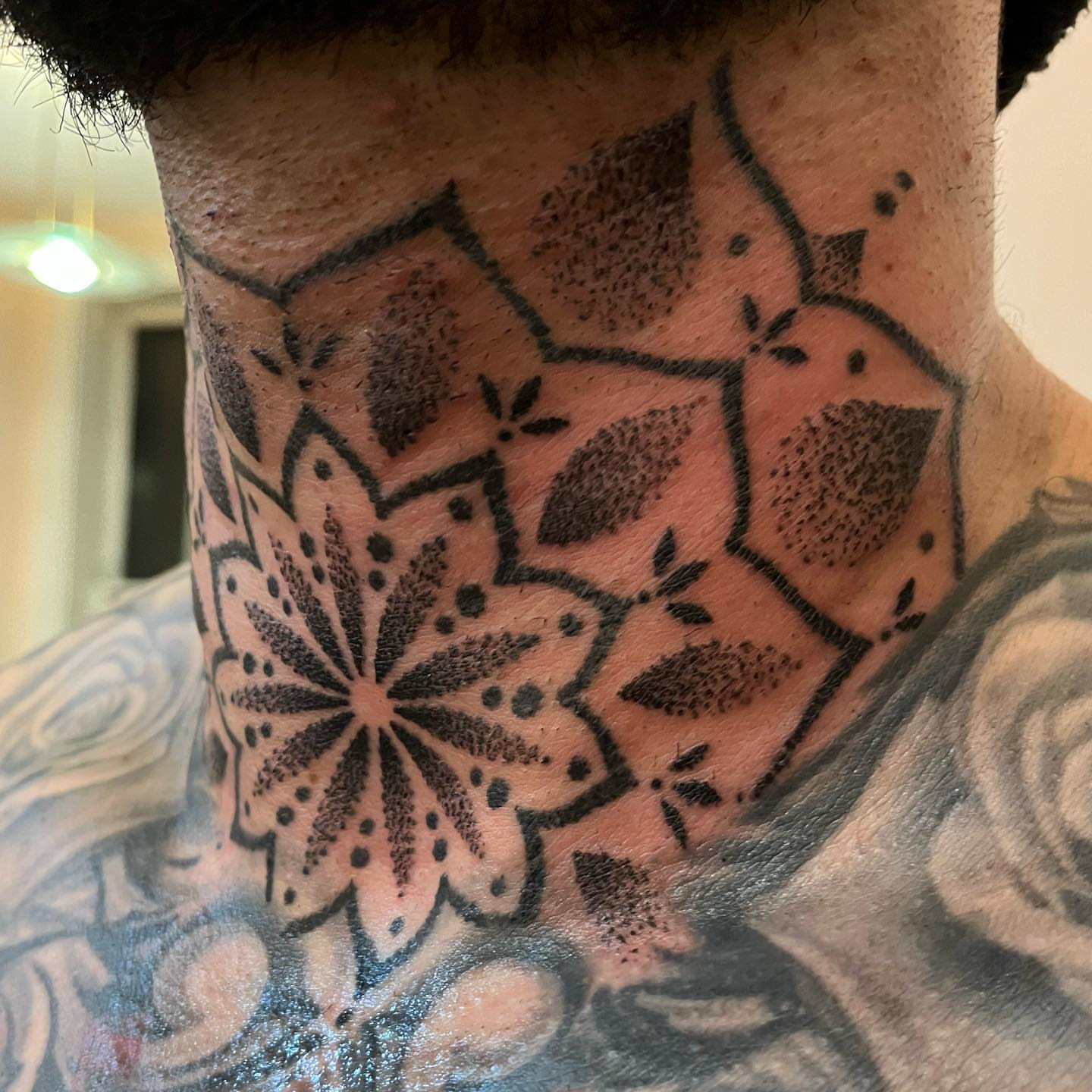 Geometric mandala dotwork tattoo on the neck by kevvy
