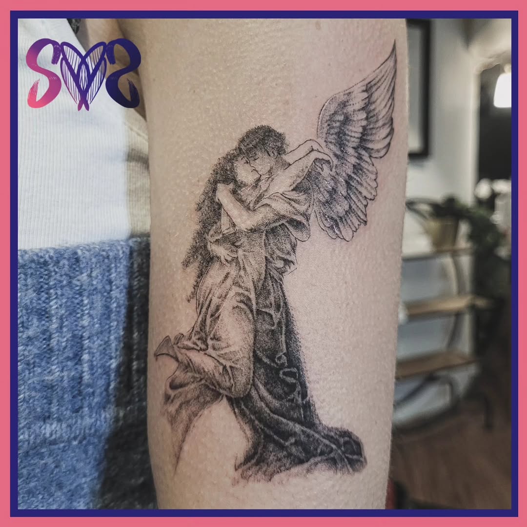 Angelic couple embracing realism tattoo on the forearm by Sooz, Tours, Centre-Val de Loire