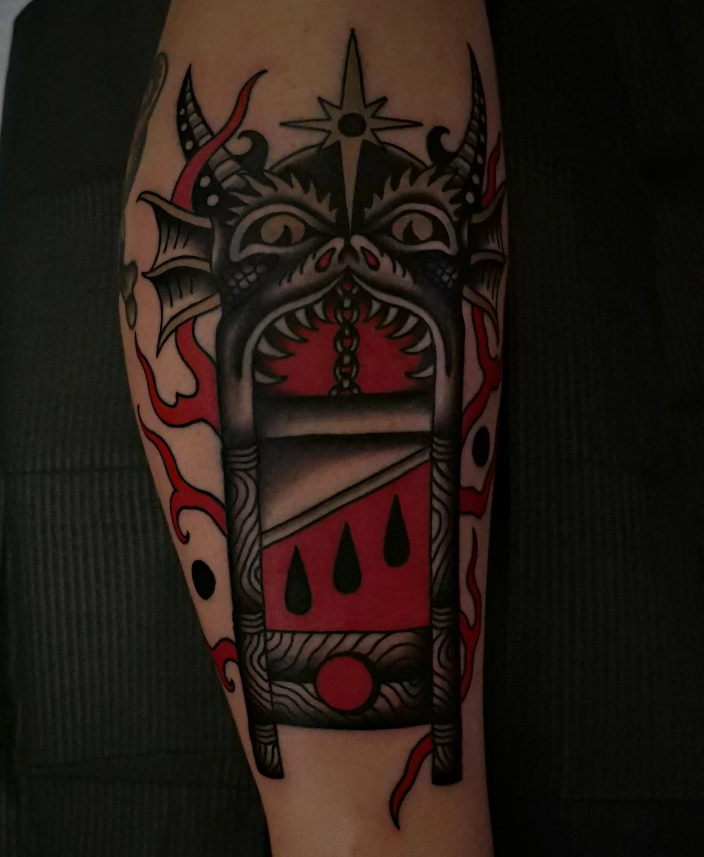 Demon mask American traditional tattoo on the forearm by Brandon Murphy