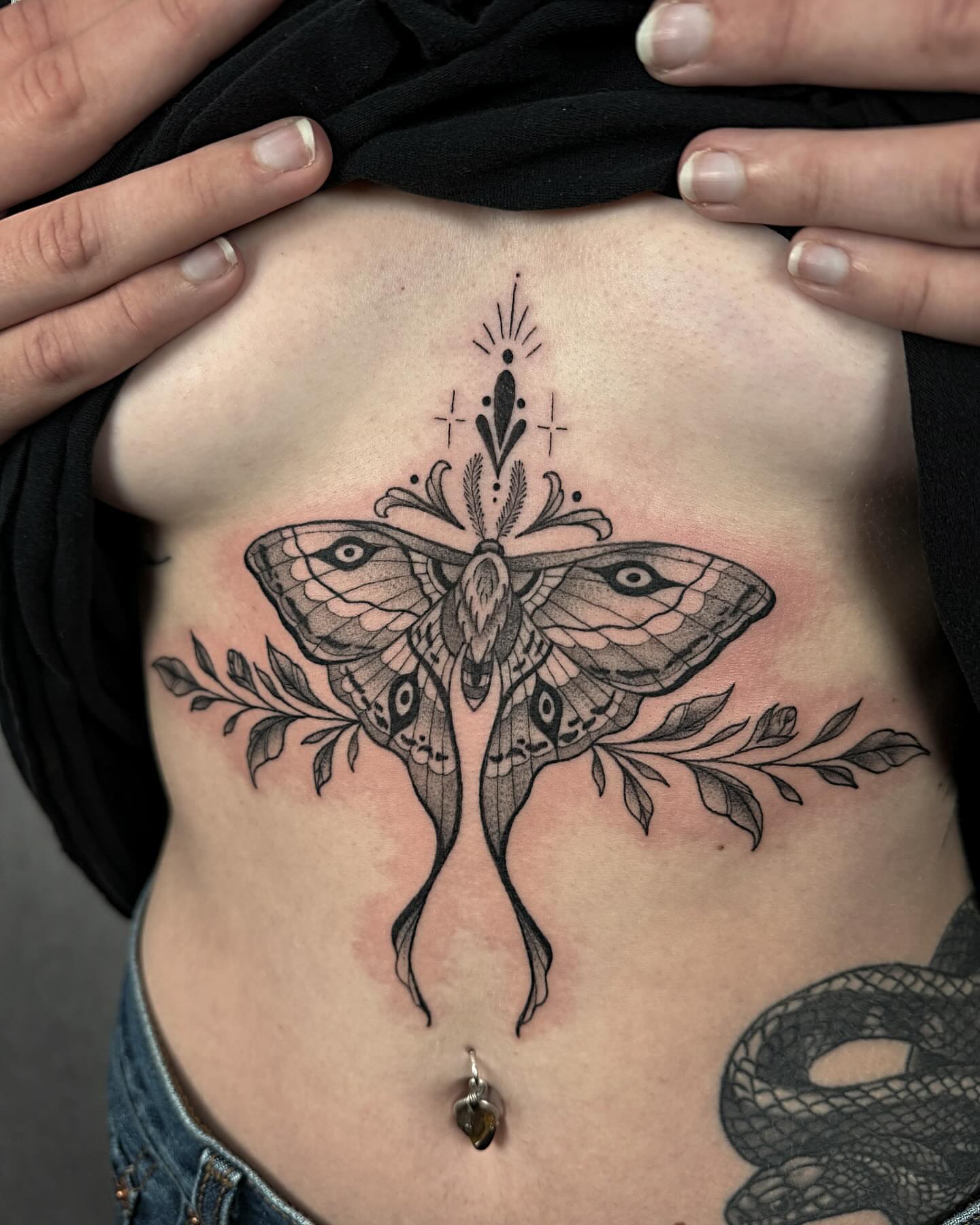 Moth and floral realism tattoo on the ribs by Mallory Miller π³οΈβπ Eugene