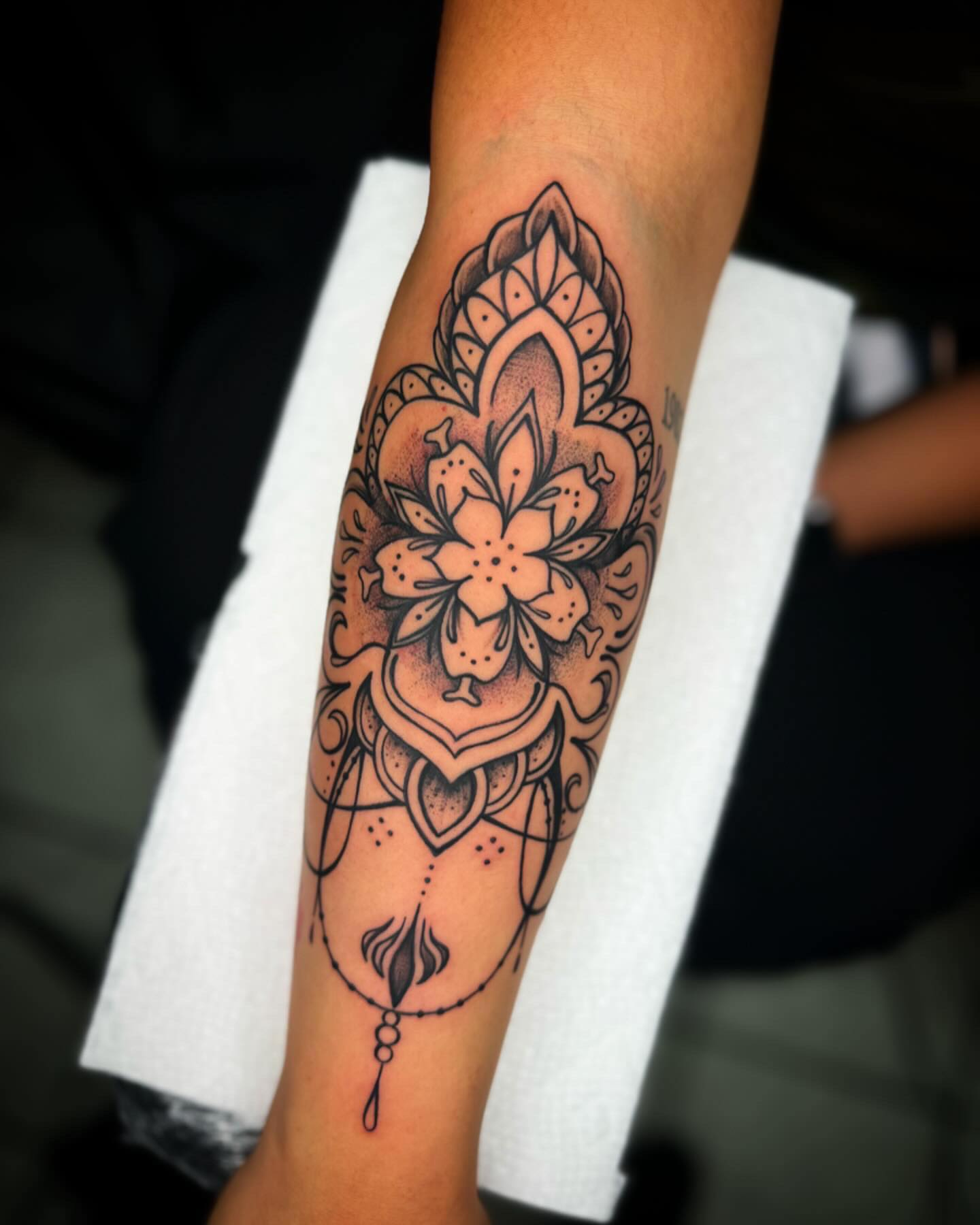 Lotus flower dotwork tattoo on the forearm by @inkhazmat