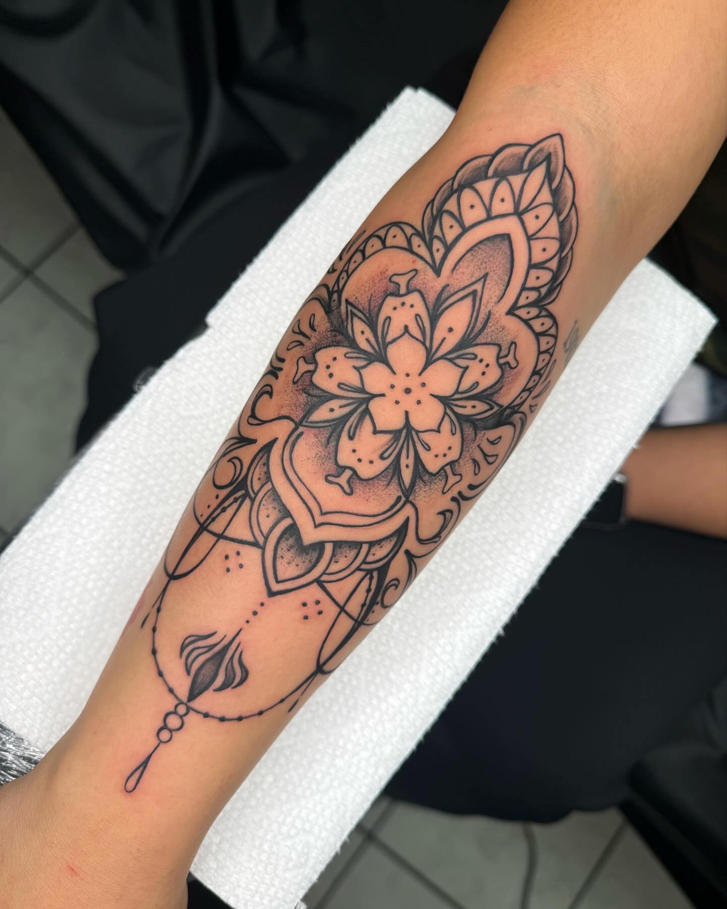 Lotus flower dotwork tattoo on the forearm by @inkhazmat