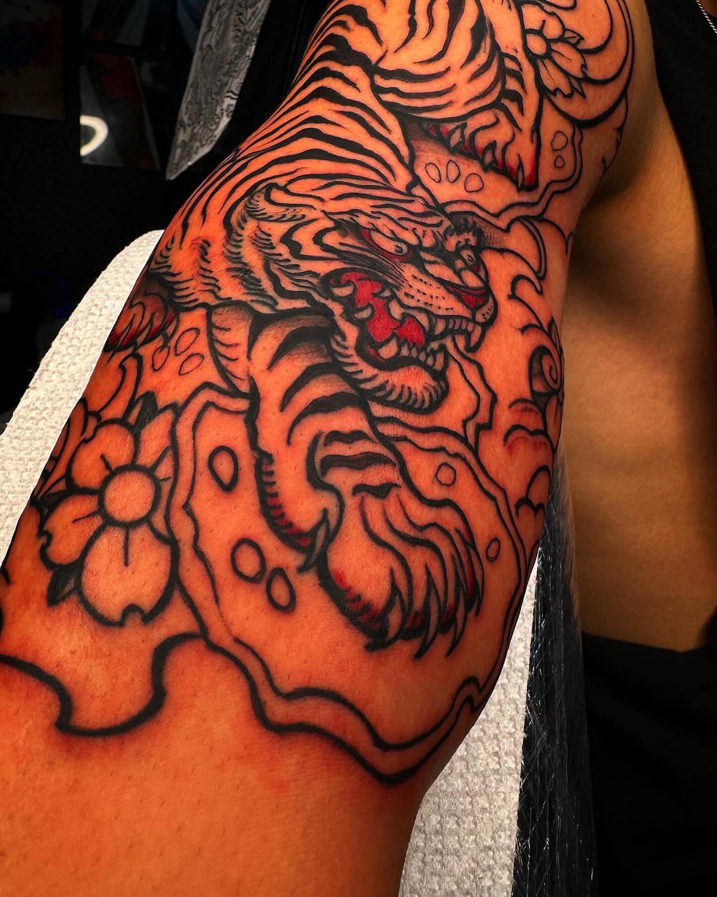 Tiger American traditional tattoo on the forearm by @inkhazmat