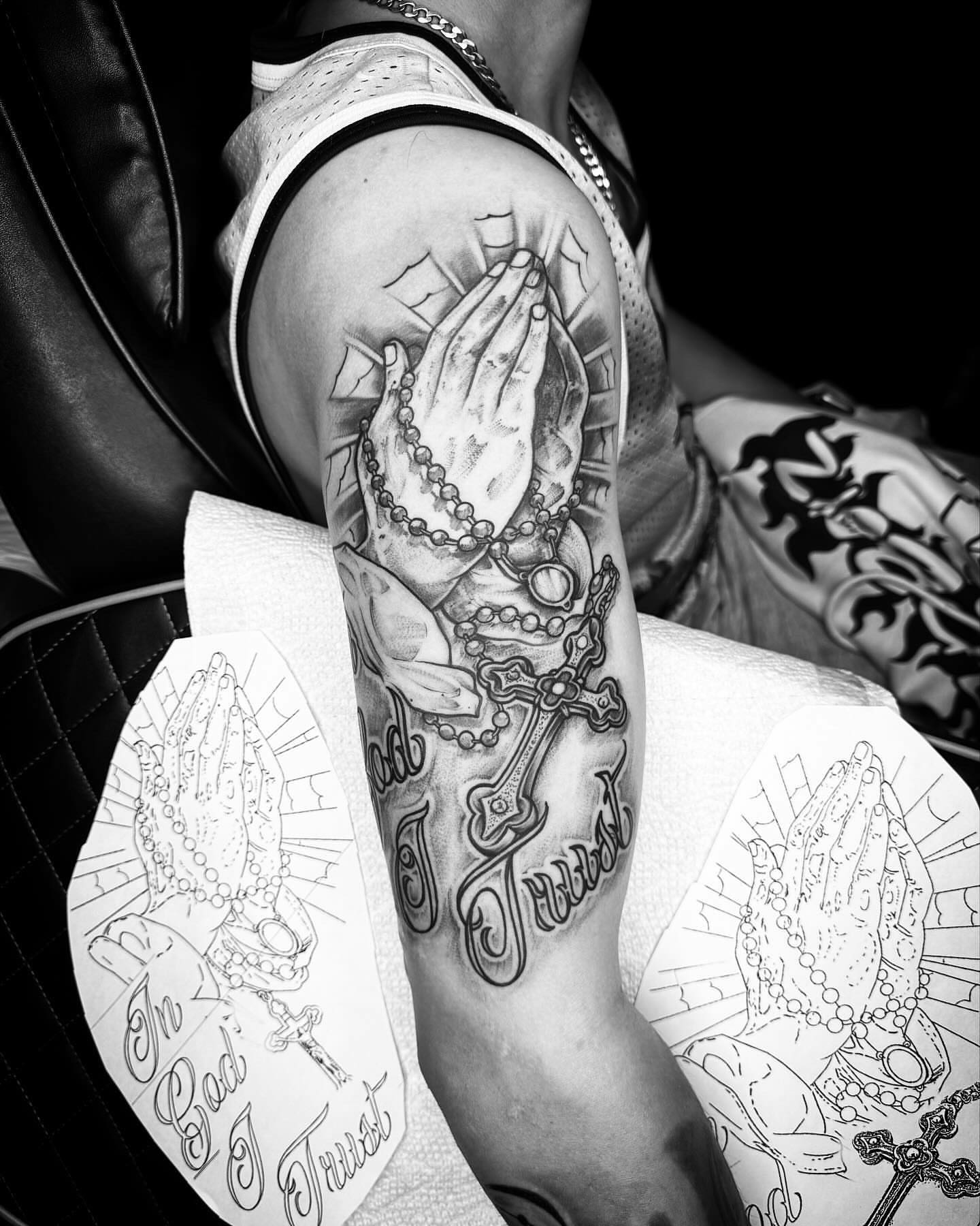 Praying hands American traditional tattoo on the forearm by @inkhazmat