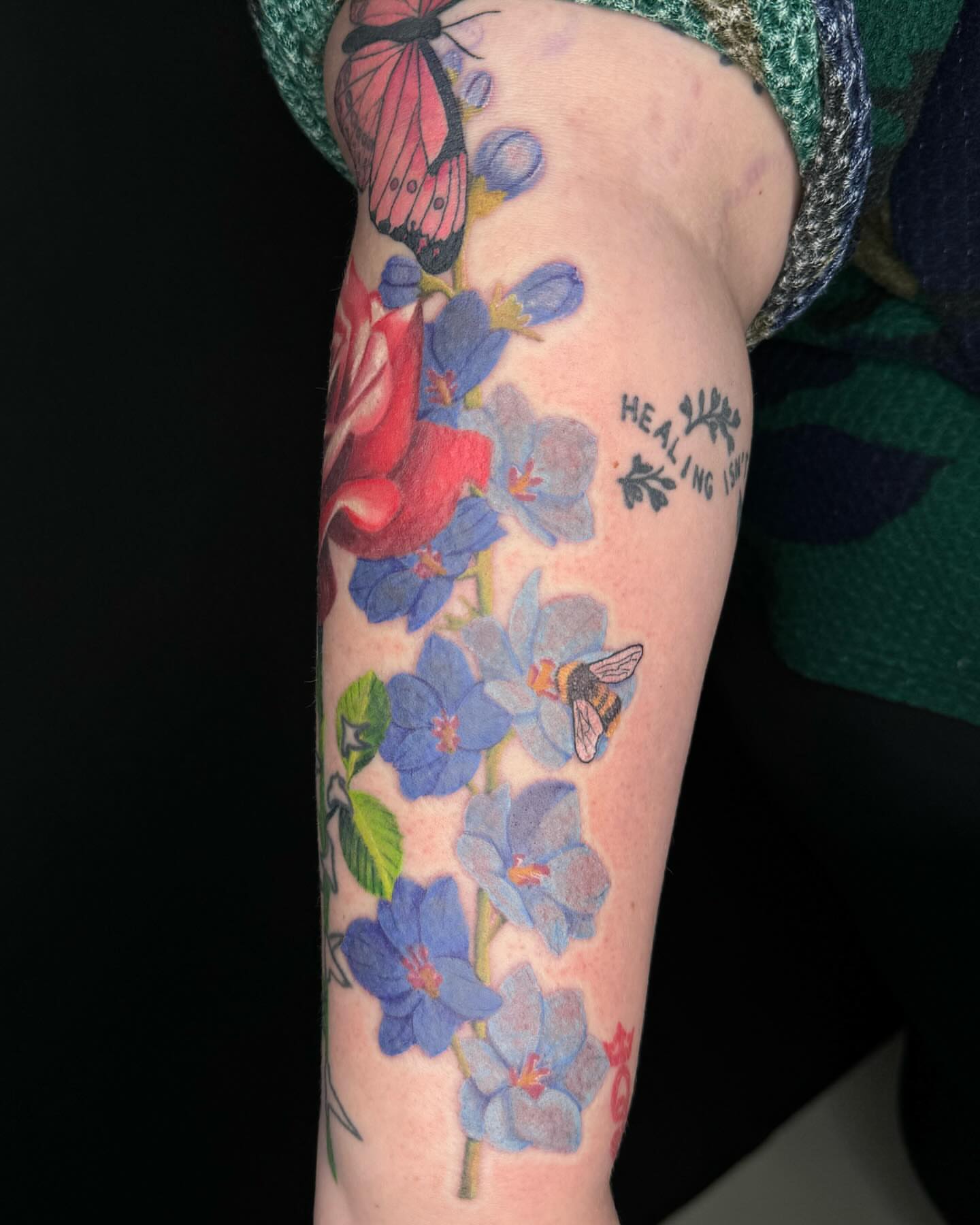 Flowers and bee realism tattoo on the forearm by @inkedbybanti
