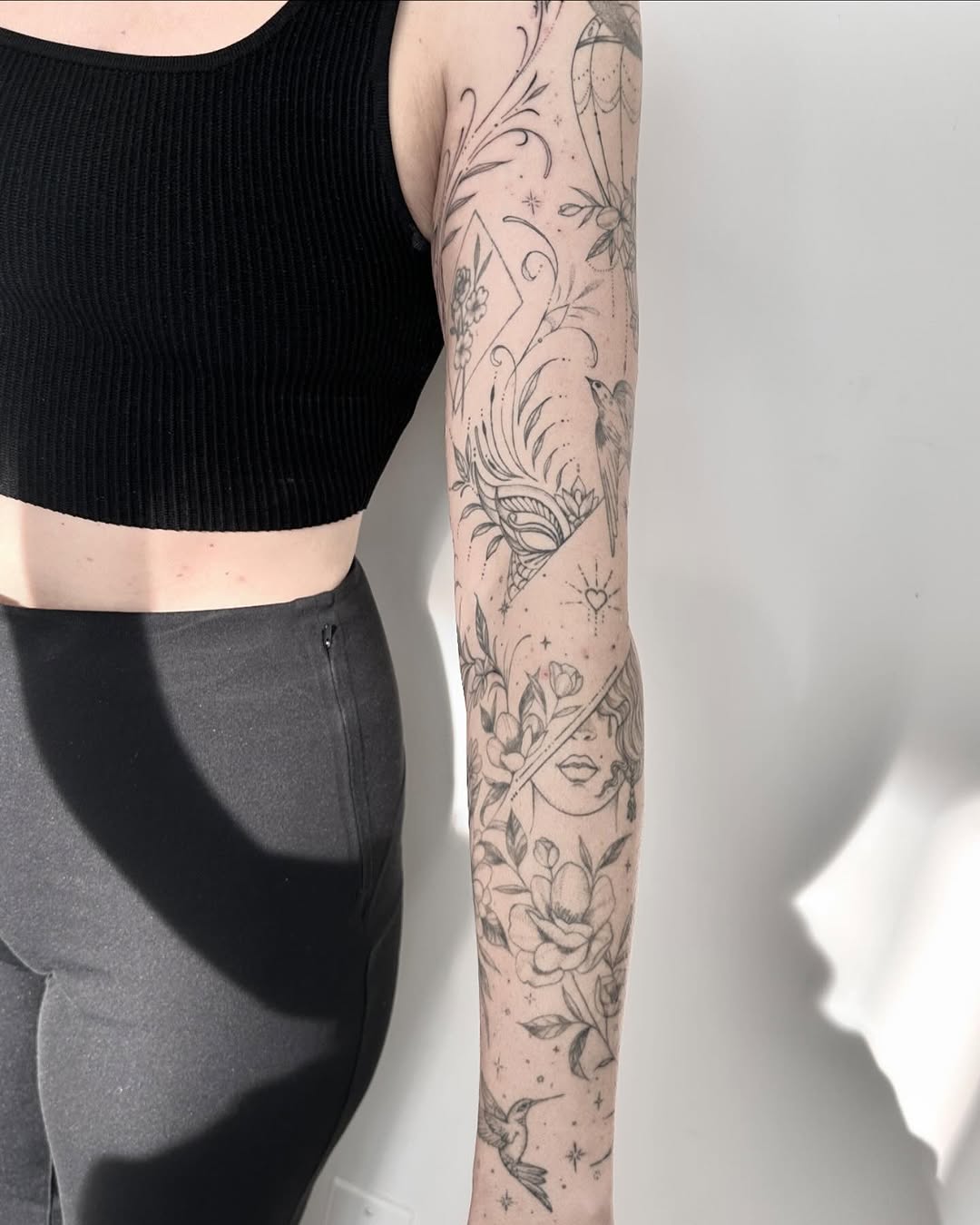 Floral and face composition ornamental tattoo on the forearm by 莹Fineline