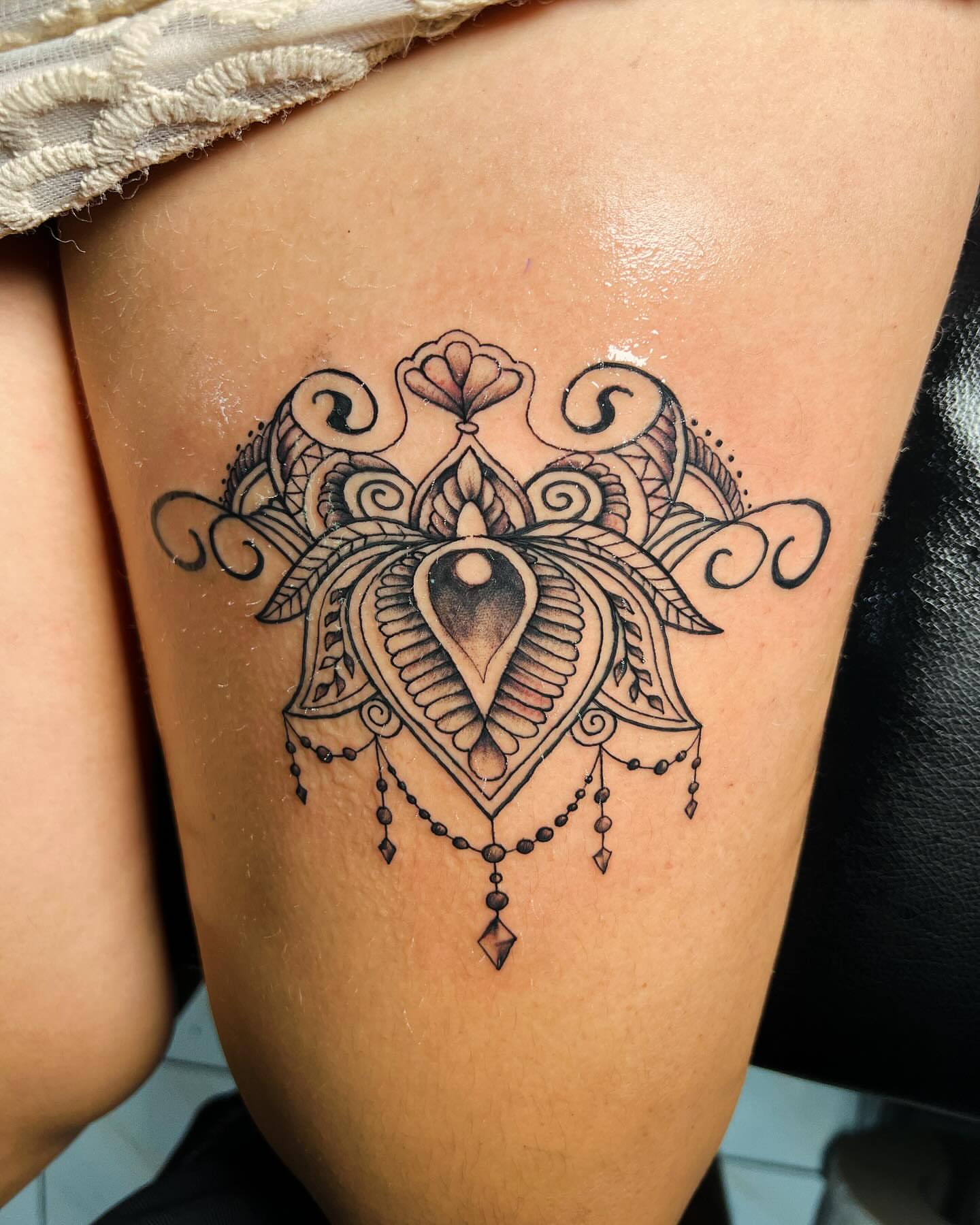 Mandala ornamental tattoo on the thigh by oxideTattoo, Morne-à-l'Eau