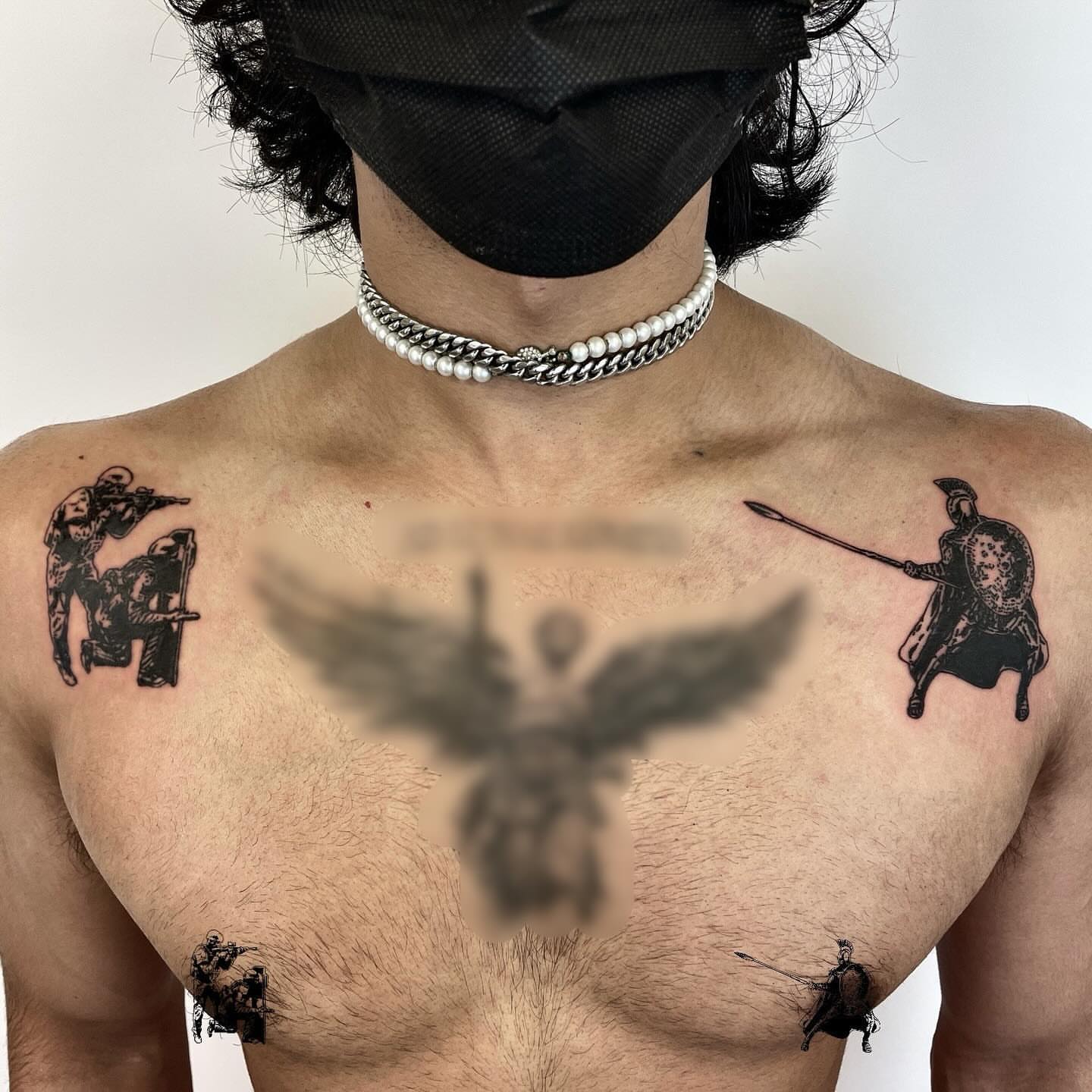 Warrior and shield black and grey tattoo on the chest by utility pole