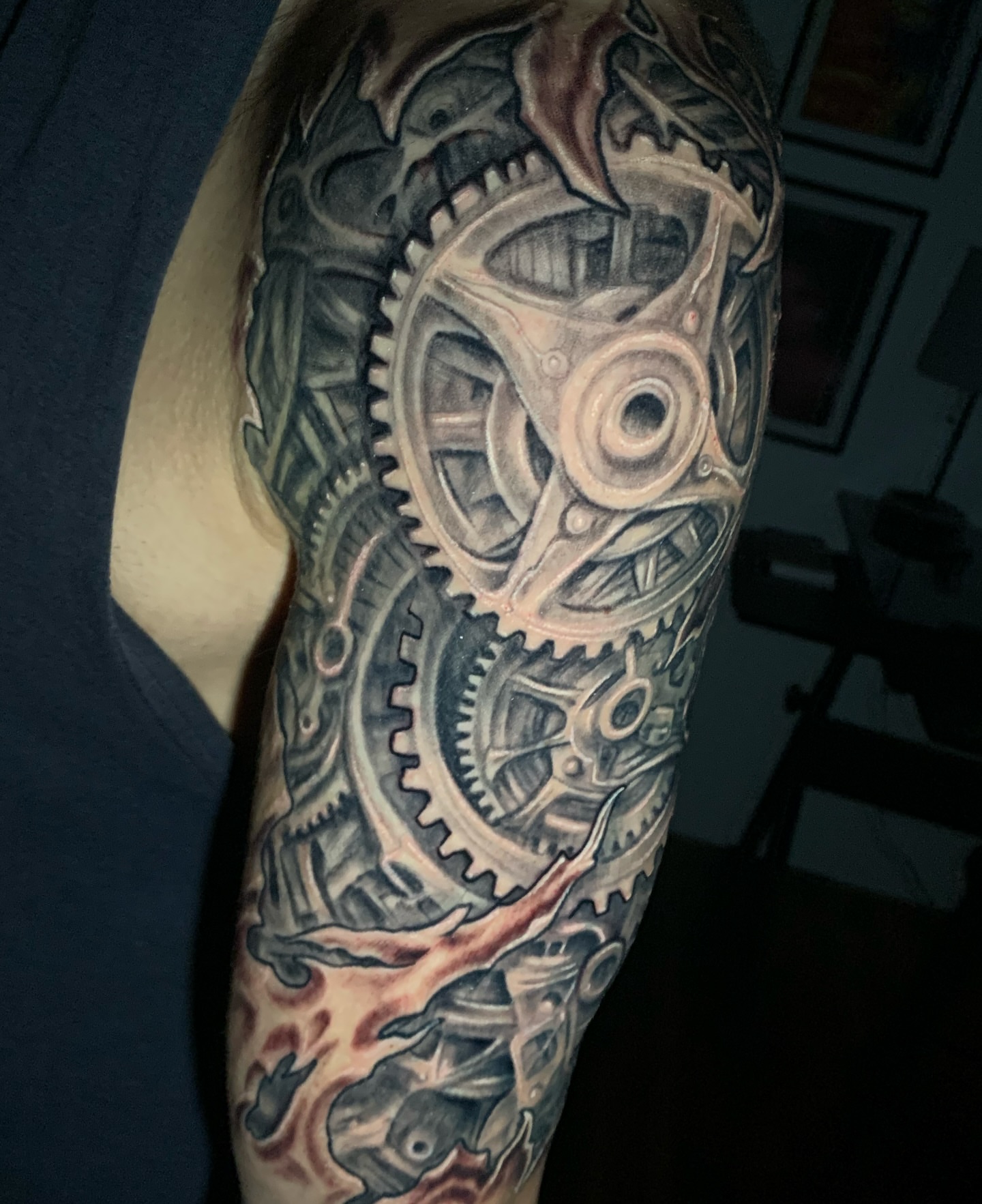 Mechanical gears geometric tattoo on the forearm by Phil Robertson