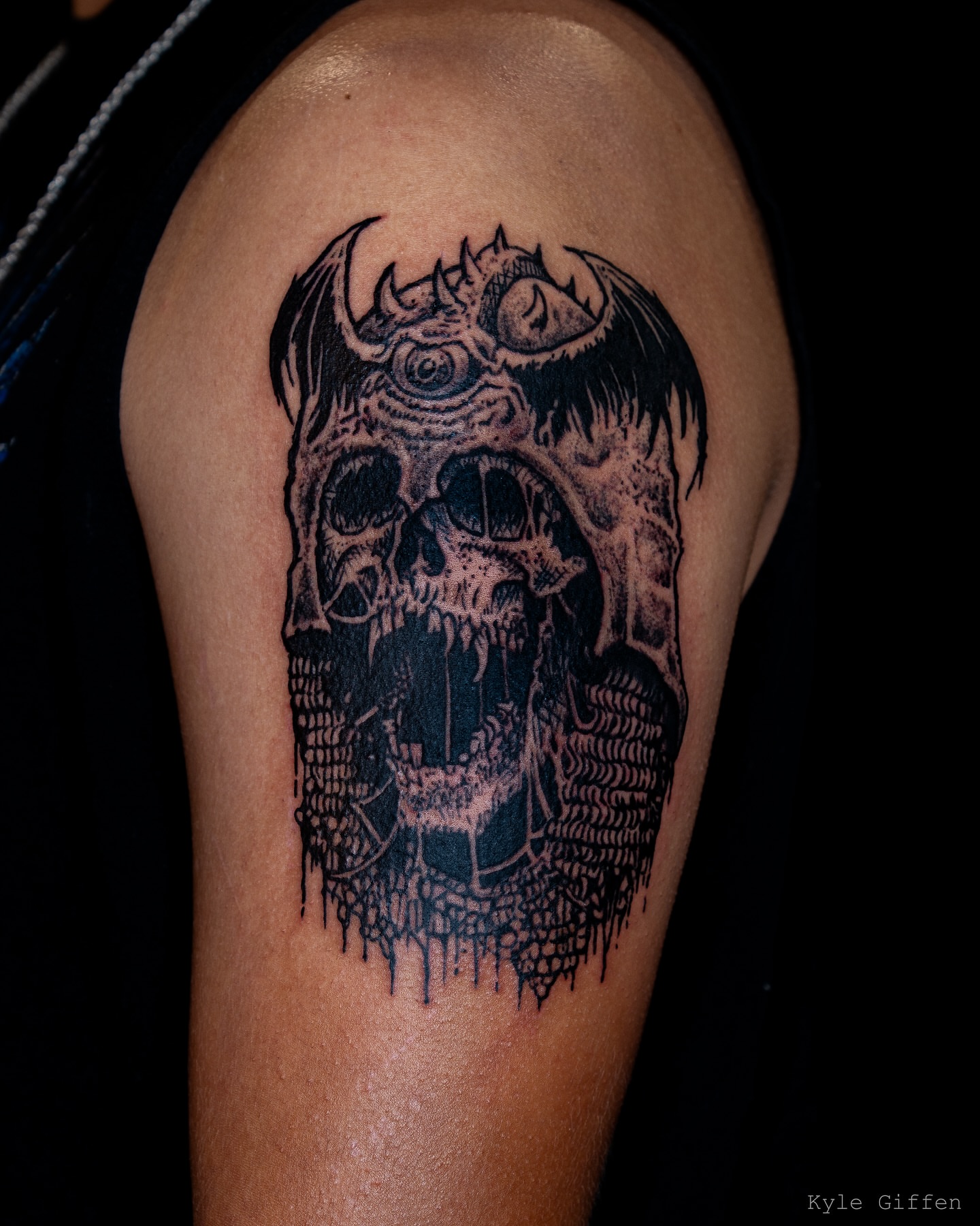 Skull black and grey tattoo on the shoulder by Kyle Giffen - Tattoo Artist
