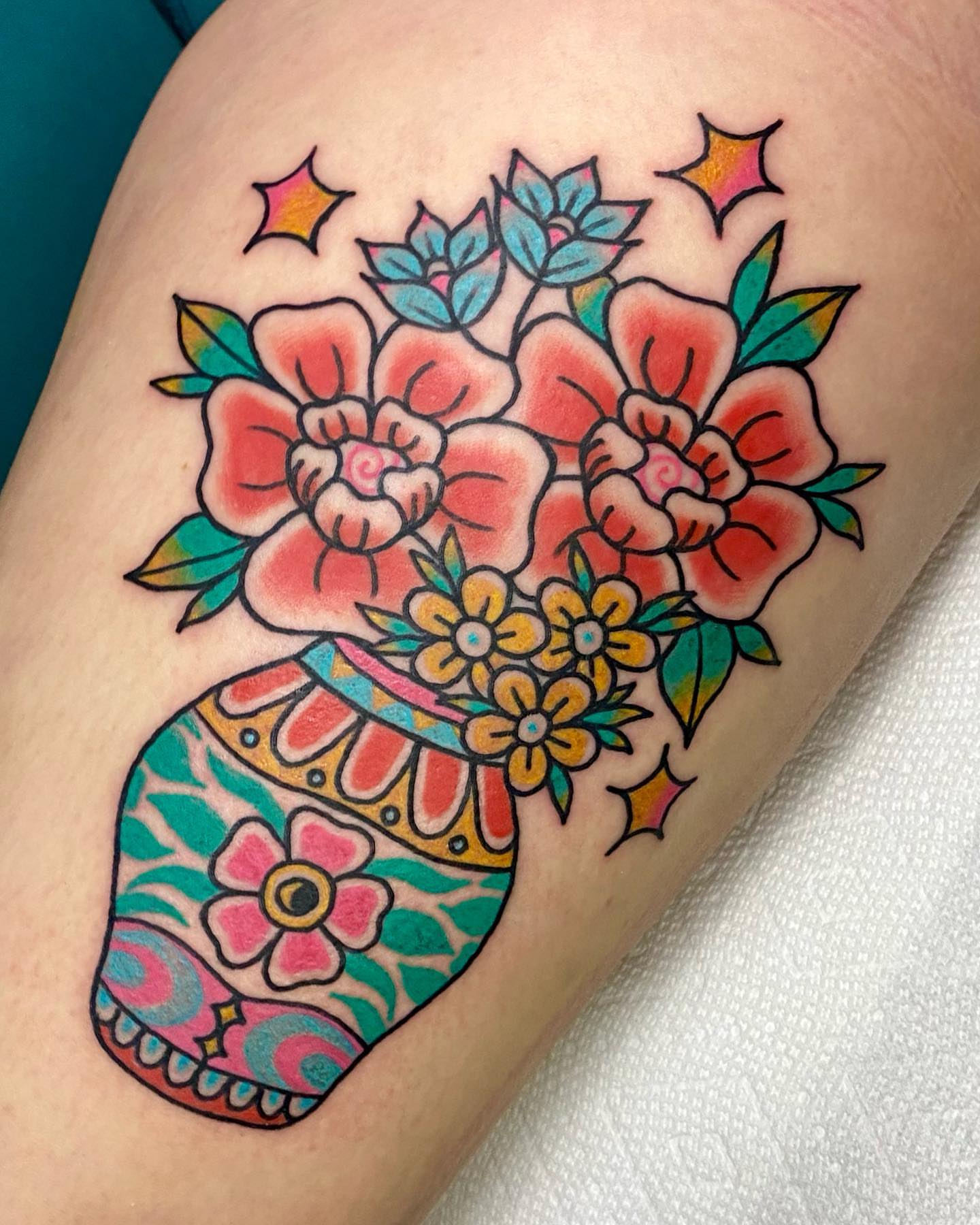 Flower vase American traditional tattoo on the forearm by Shana