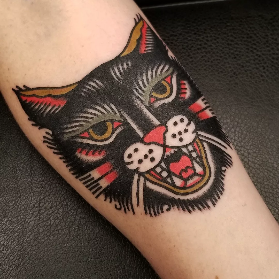 Cat American traditional tattoo on the forearm by Deke Harms, Bend, Oregon