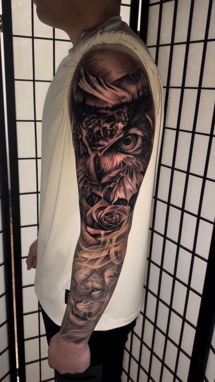 Skull and roses sleeve realism tattoo by Flamure Islami