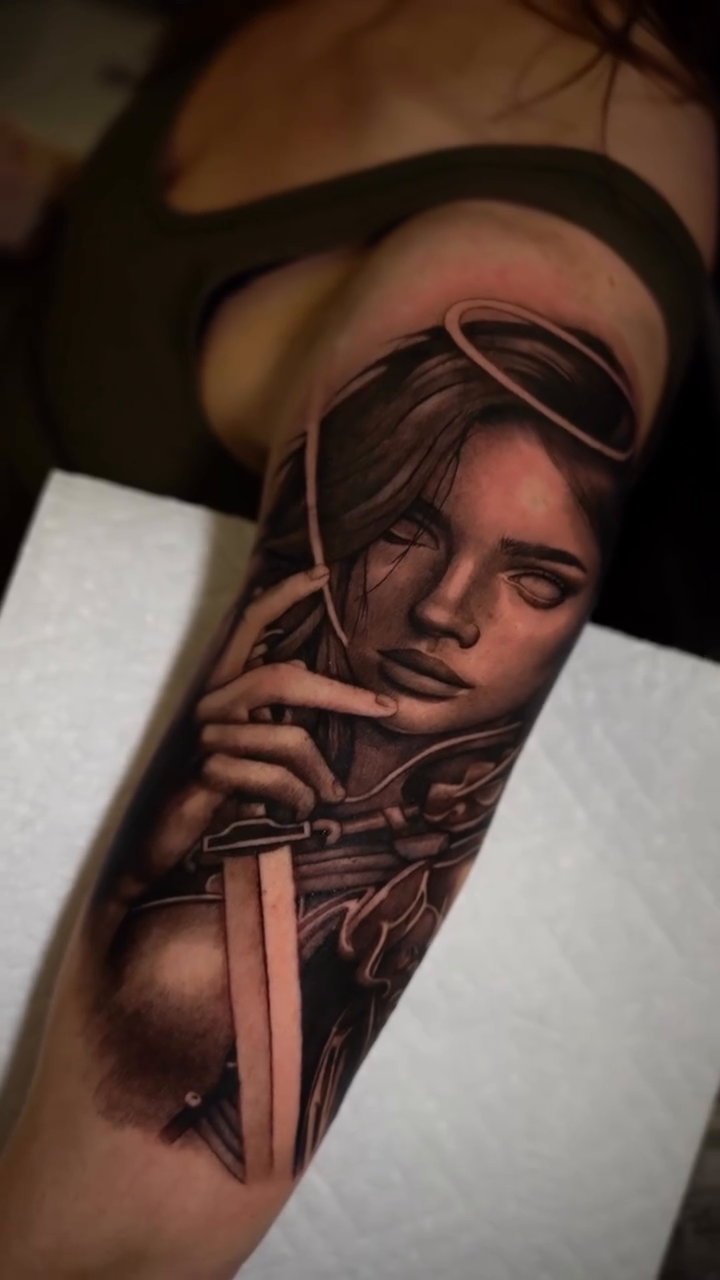 Woman with sword realism tattoo by Risa