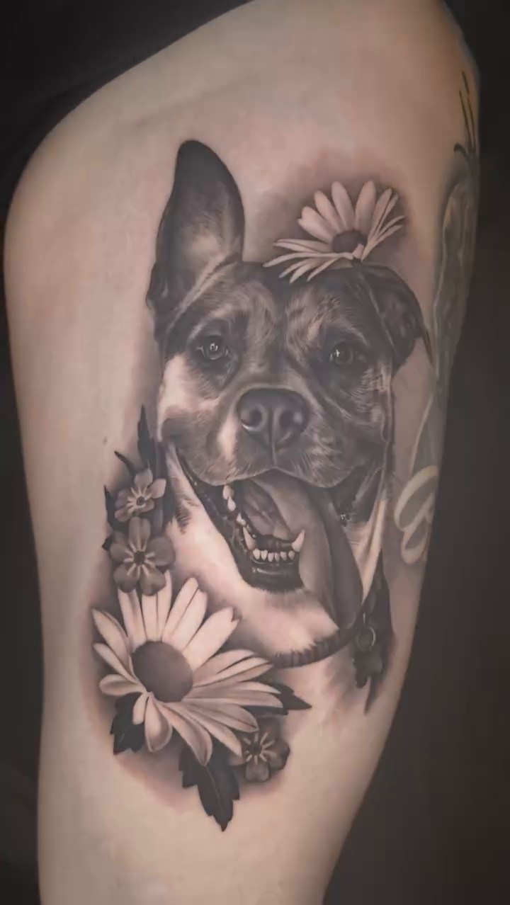 Dog with flowers realism tattoo by Ana Reyes
