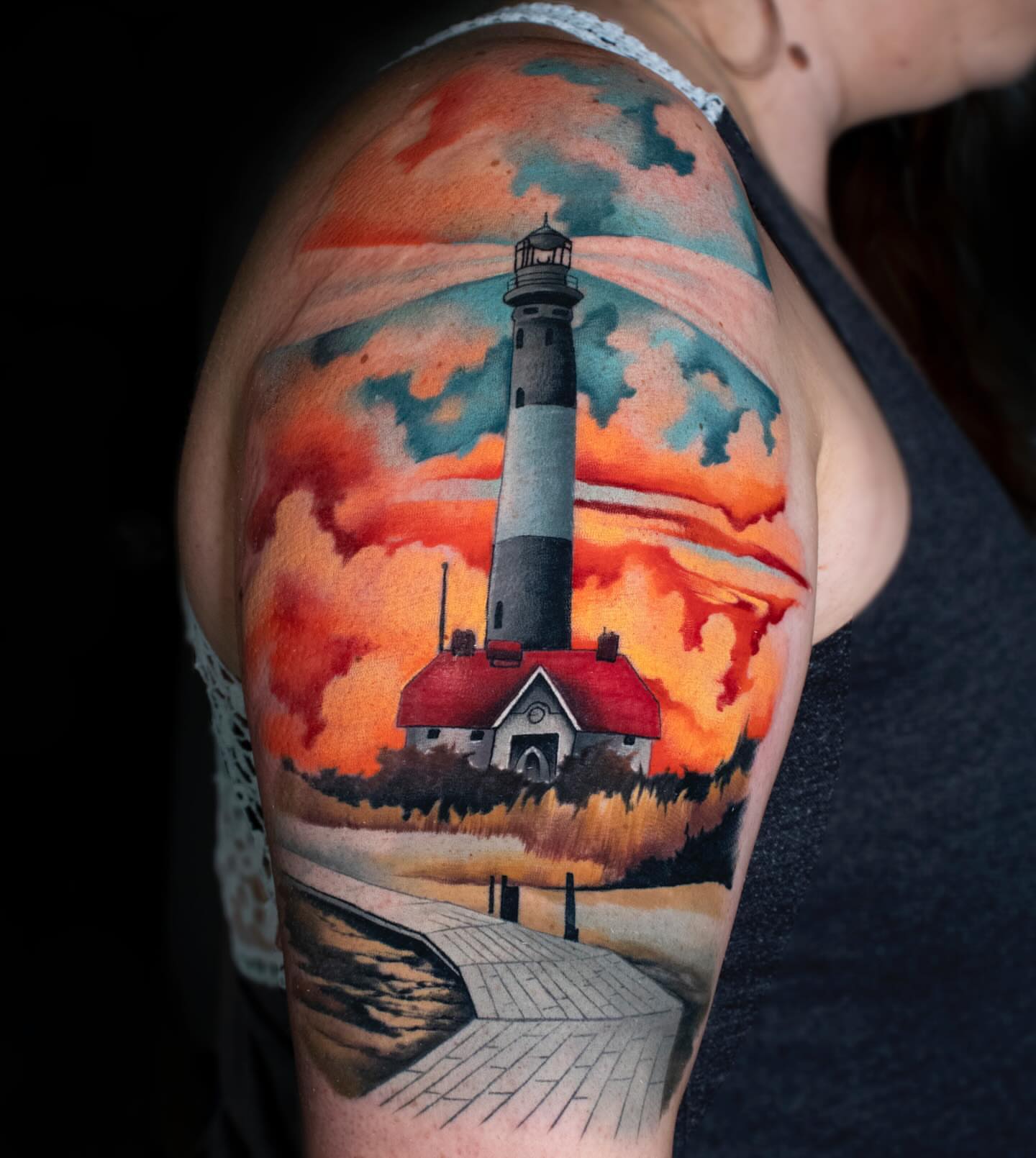 Lighthouse realism tattoo on the shoulder by Luke Benavidez