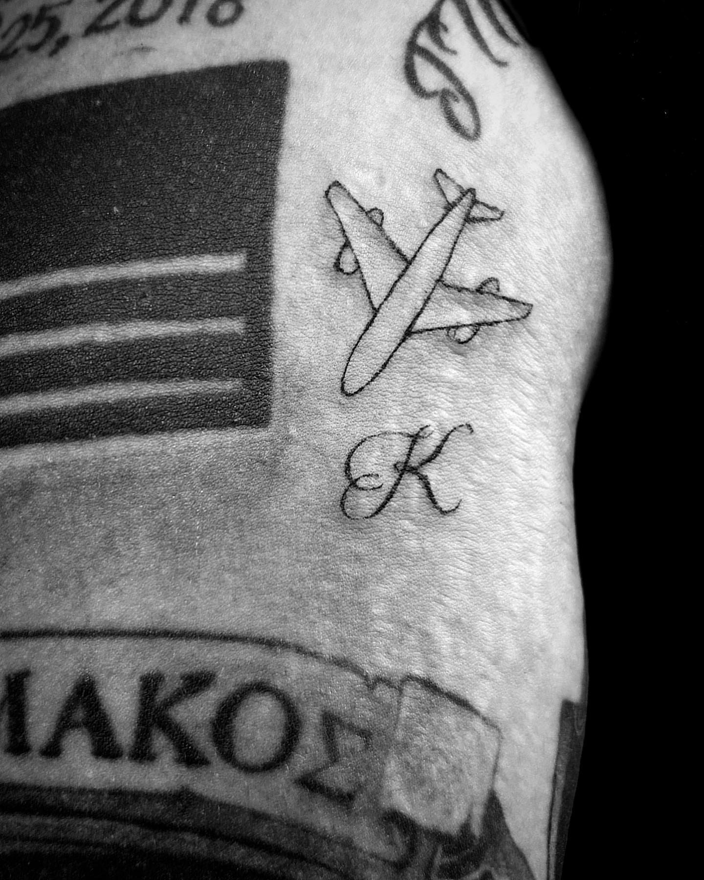 Airplane black and grey tattoo on the forearm by Bear
