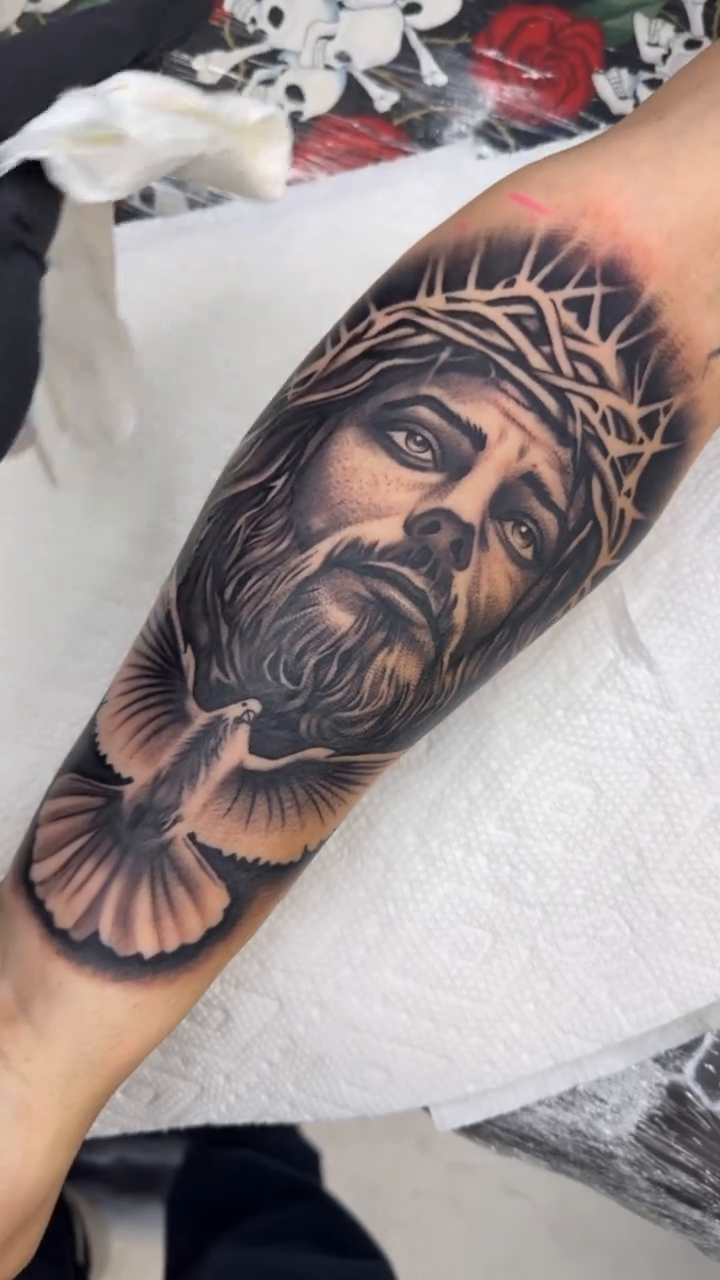 Jesus Christ and a dove realism tattoo by Joseph Alvarado