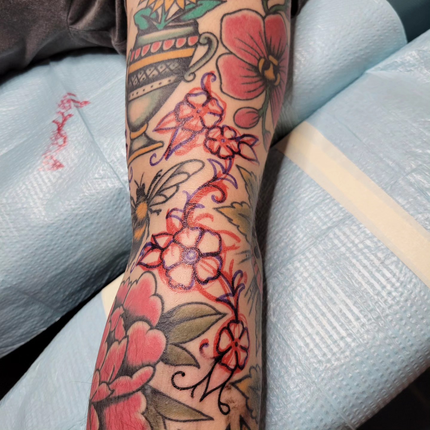 Floral arrangement American traditional tattoo on the forearm by Jared Green