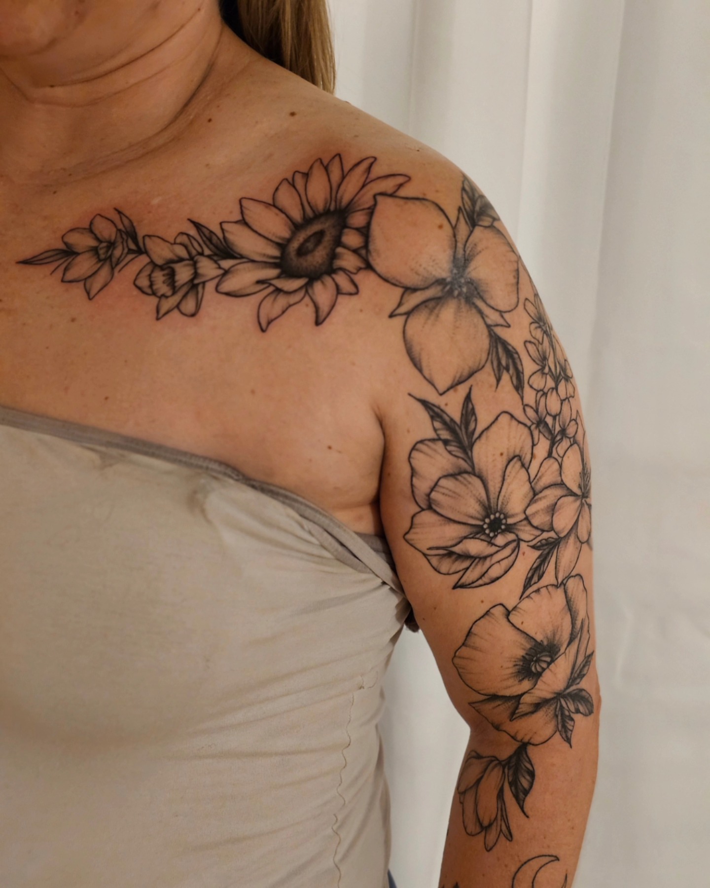 Flower bouquet black and grey tattoo on the shoulder by Madelynne