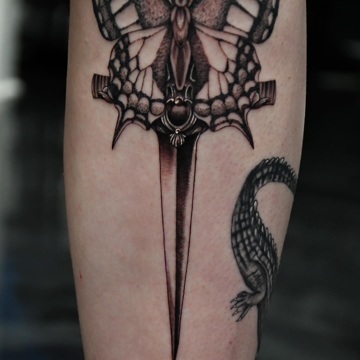 Dragon and butterfly geometric tattoo on the forearm by Jaiden Ducoff